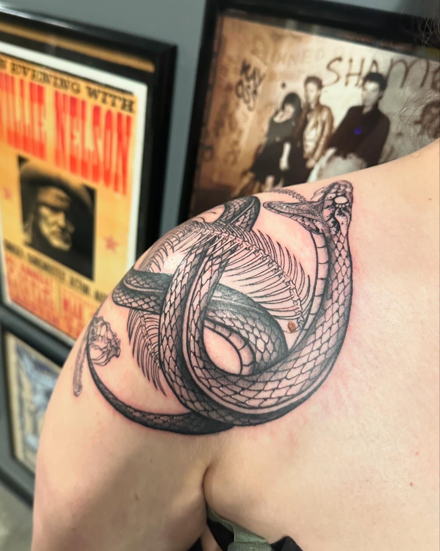 Snake black and grey tattoo on the shoulder by Kerri Colello Sittenauer