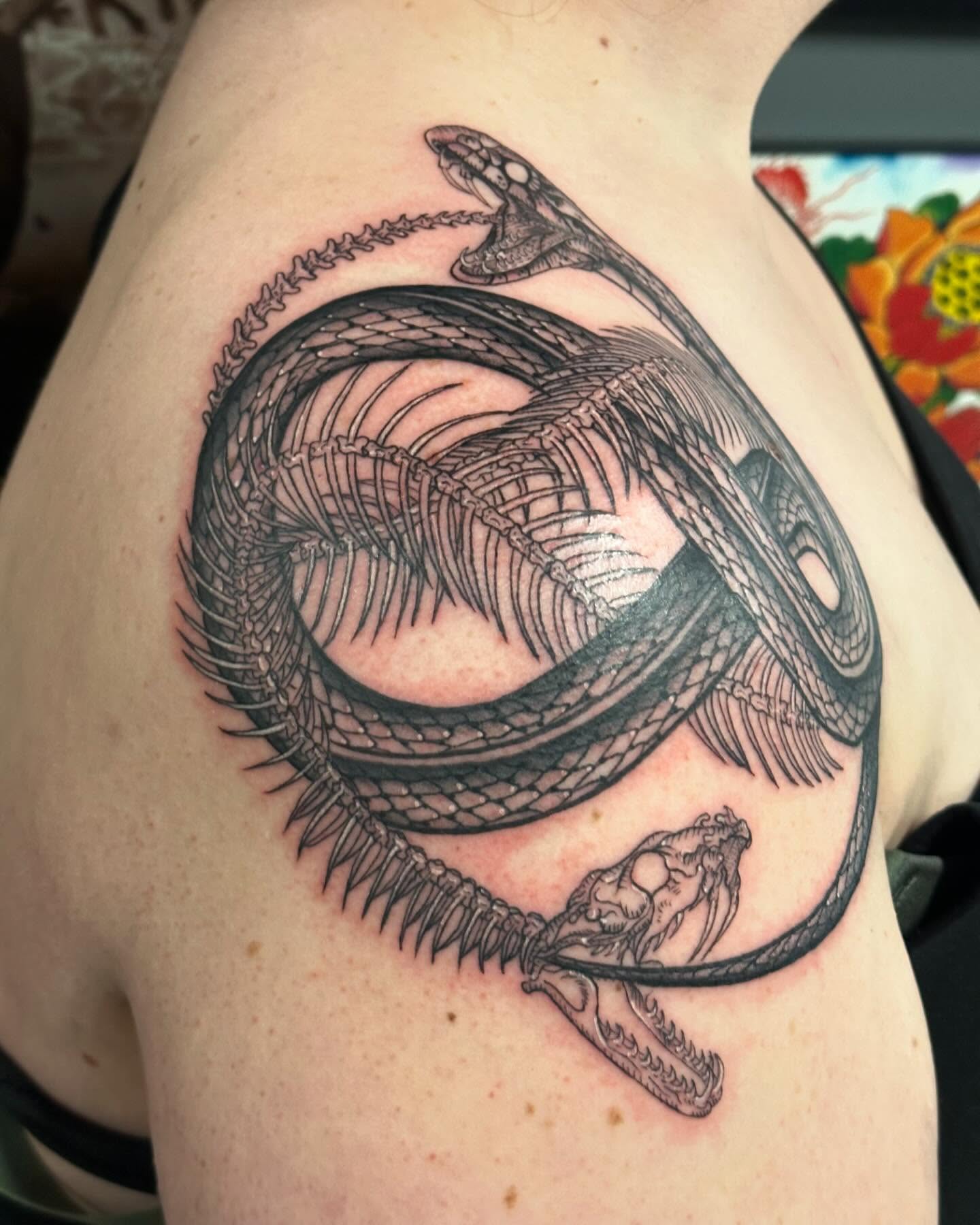 Snake geometric tattoo on the shoulder by Kerri Colello Sittenauer