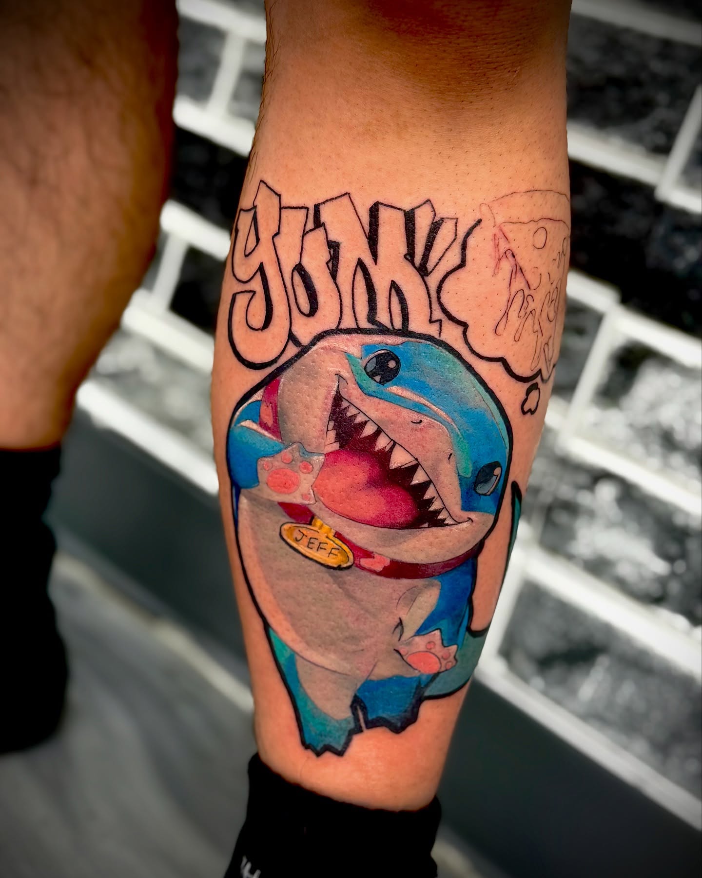 Dolphin new school tattoo on the forearm by Mitsuko Ching