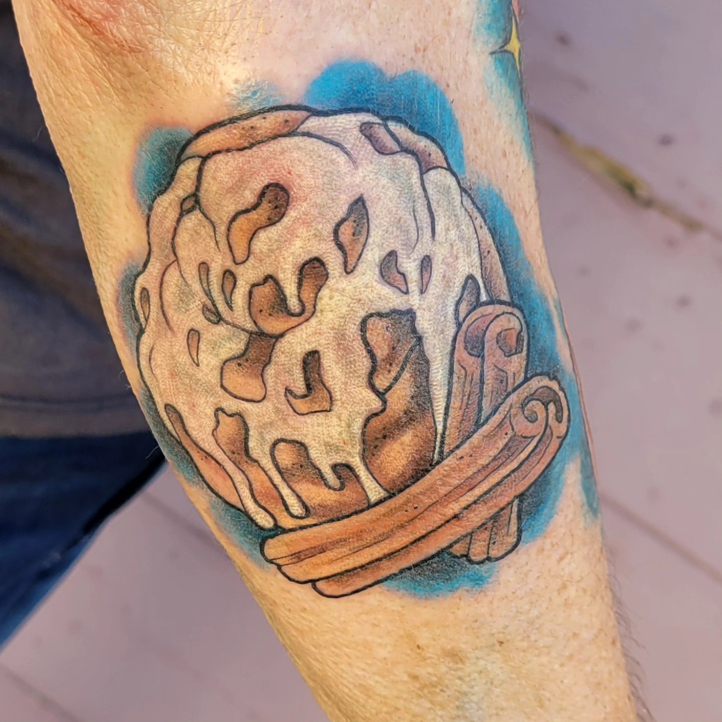 Ice cream cone realism tattoo on the forearm by Austin Berry