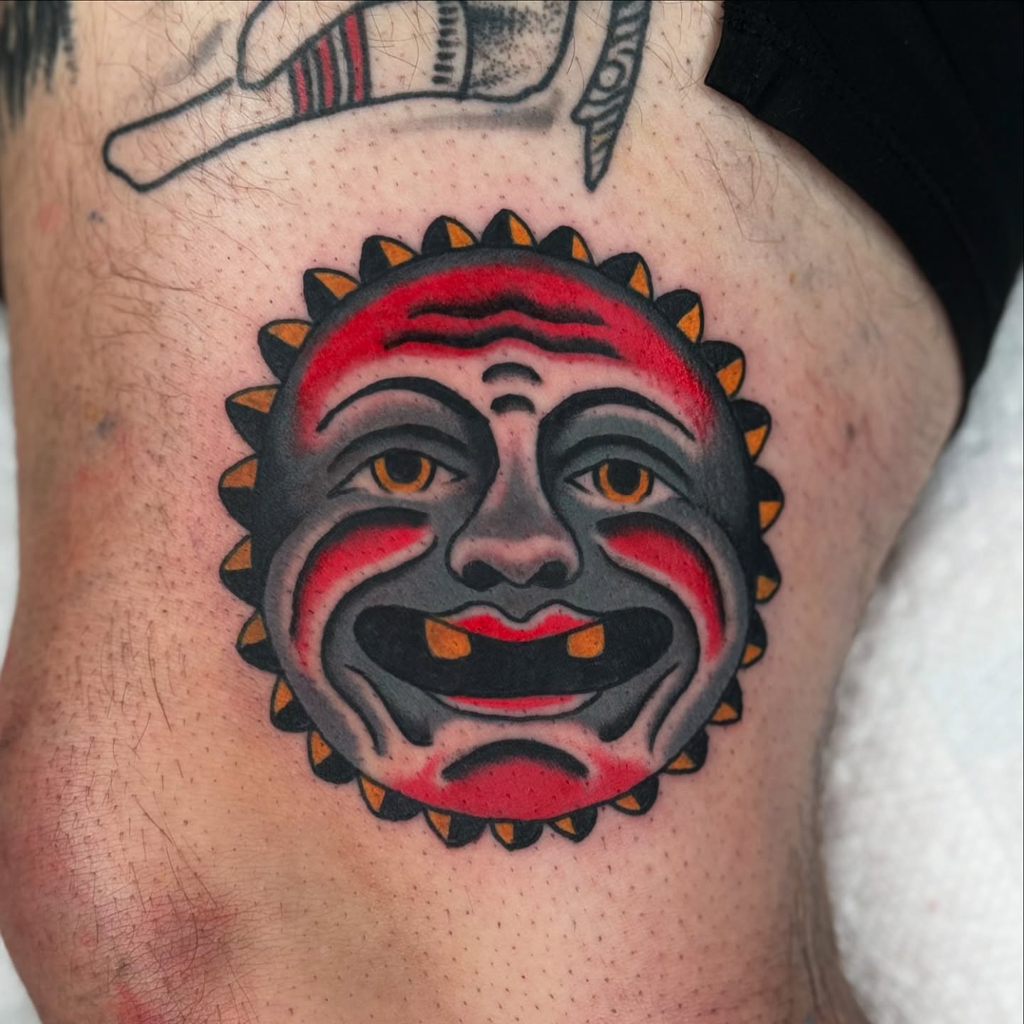 Clown mask American traditional tattoo on the thigh by Domanick Libretti, Nashville, Tennessee