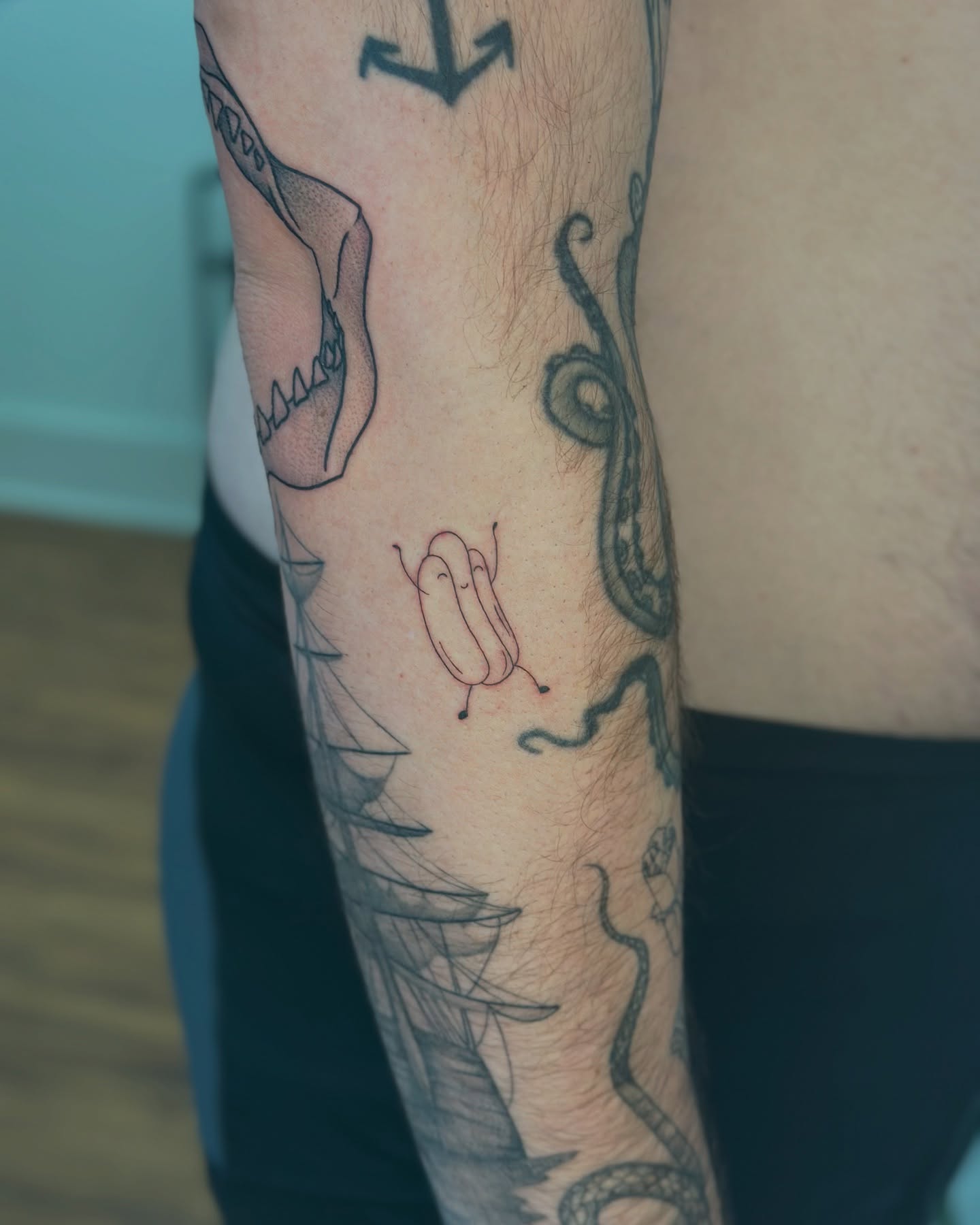 Octopus and worm black and grey tattoo on the forearm by ๐
๐๐๐๐๐ ๐๐๐๐๐๐