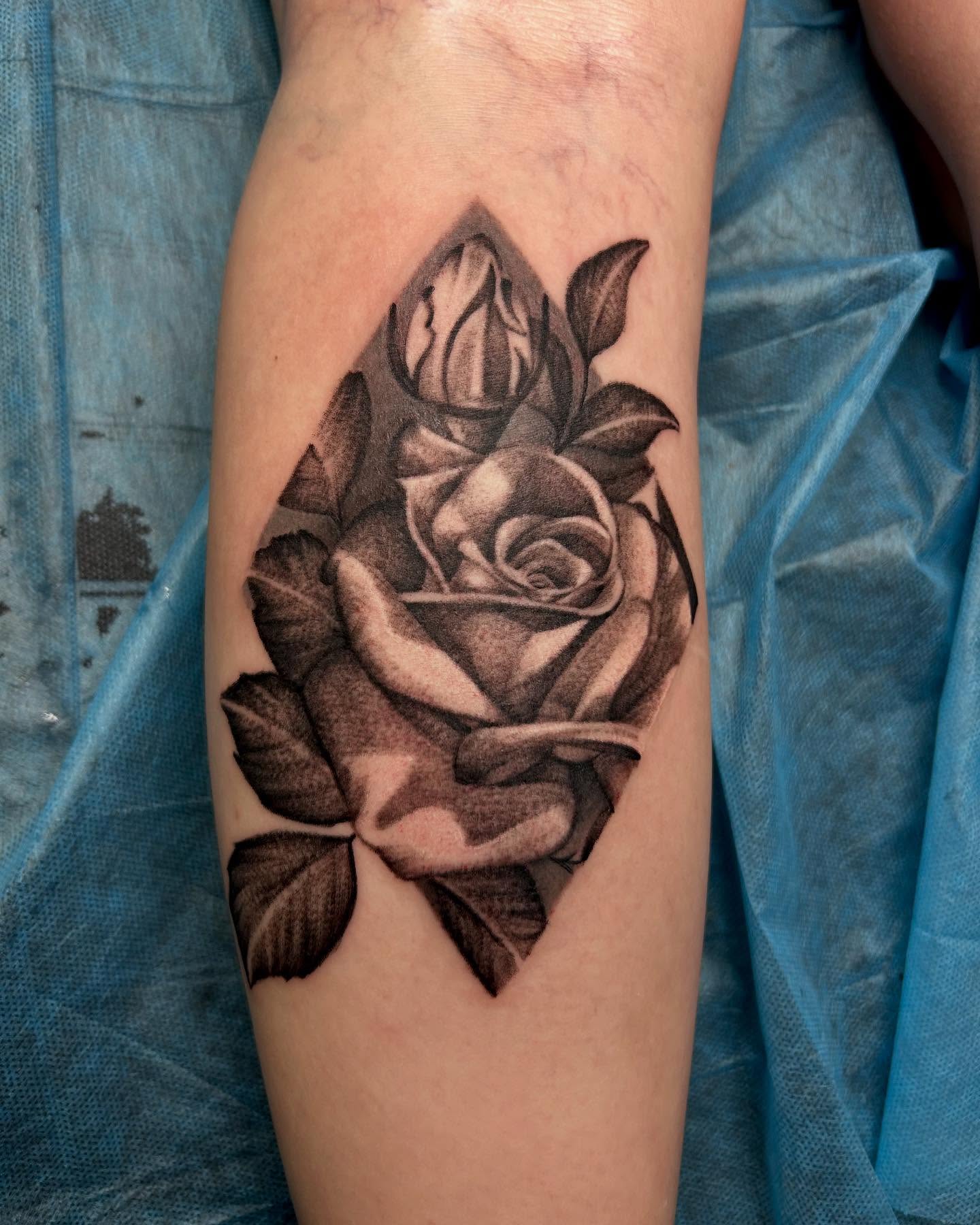 Rose black and grey tattoo on the forearm by Josh Williams, Chattanooga, Tennessee