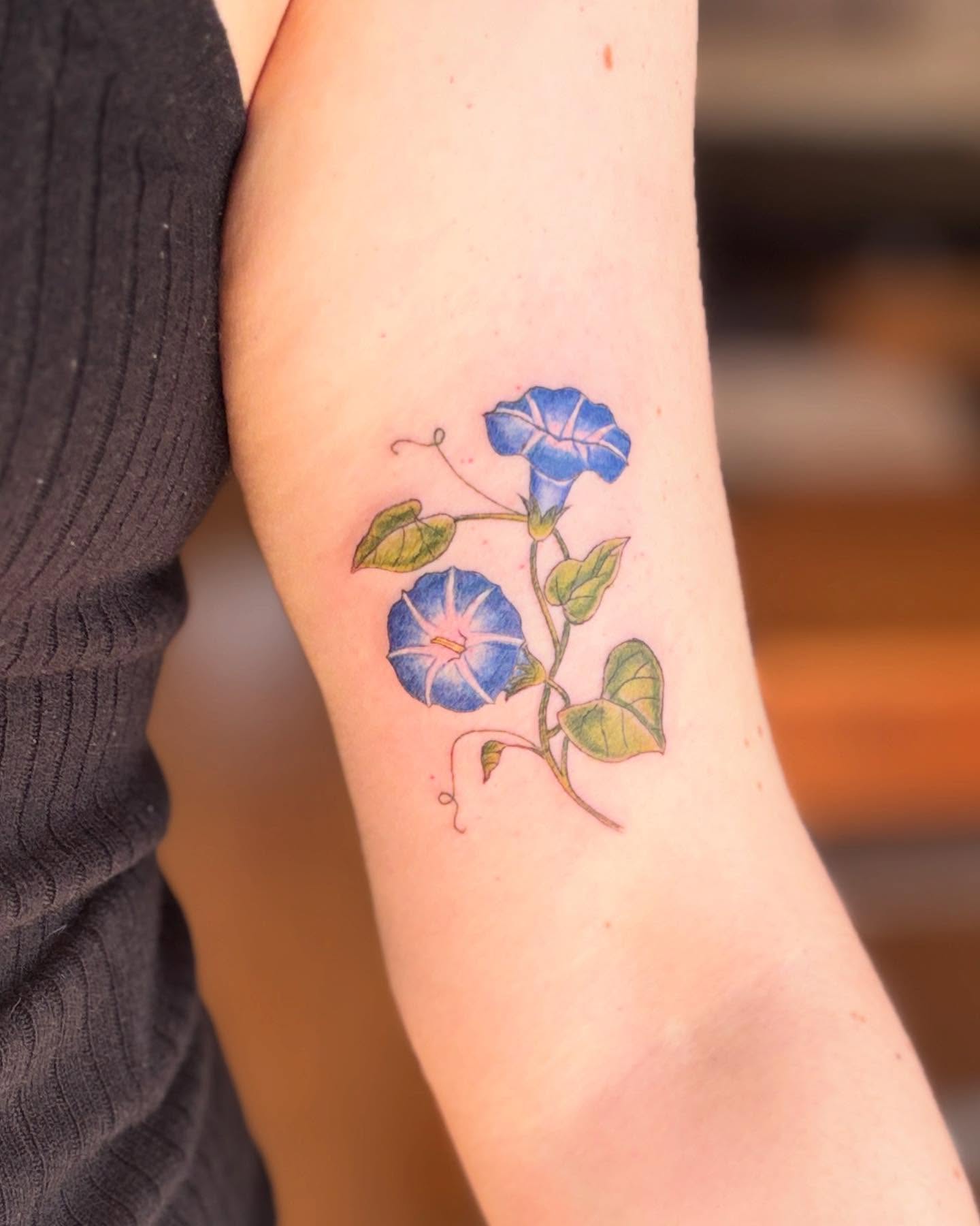Morning glory flowers dotwork tattoo on the forearm by Reba Slate