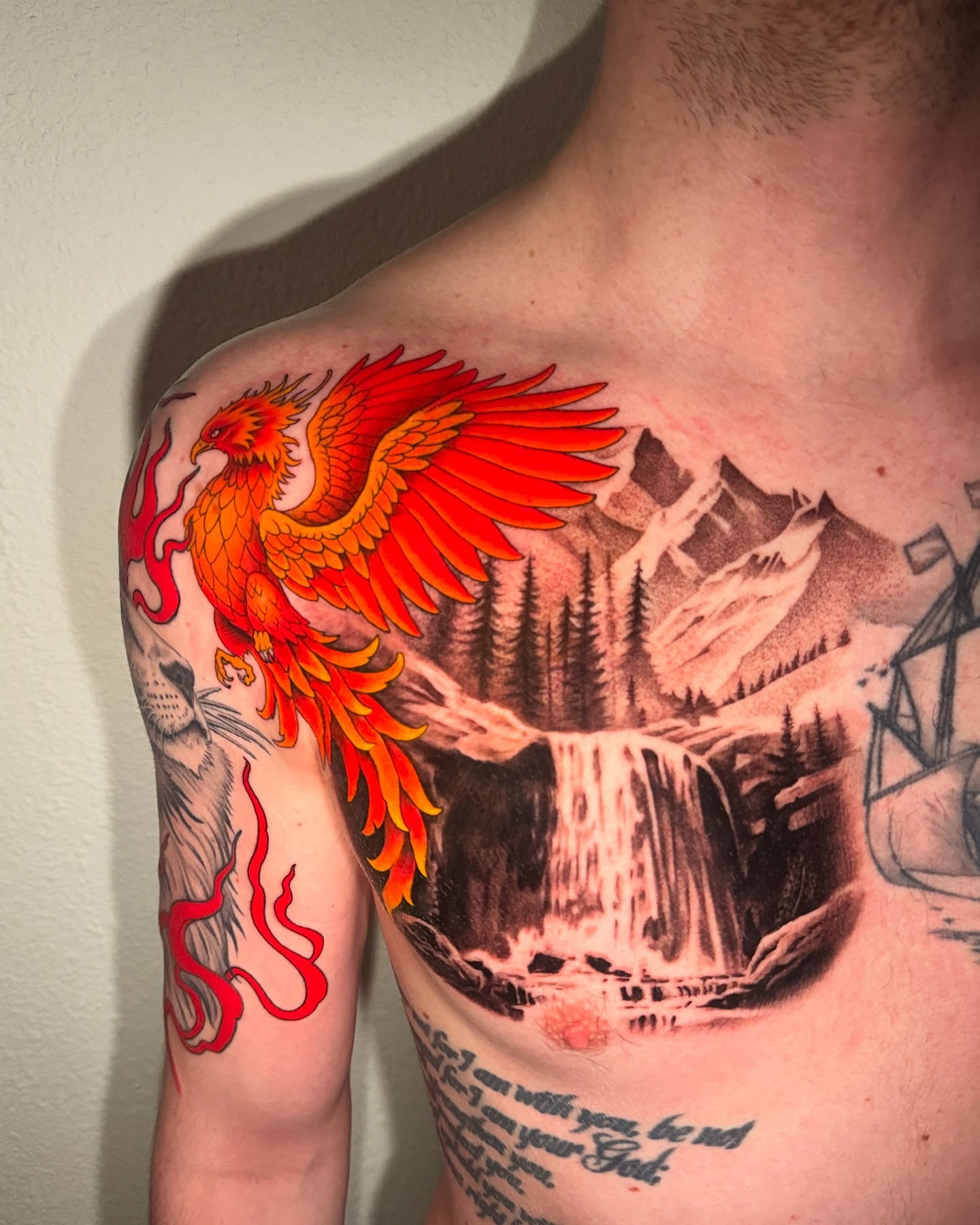 Phoenix American traditional tattoo on the chest by Julio Ferrer