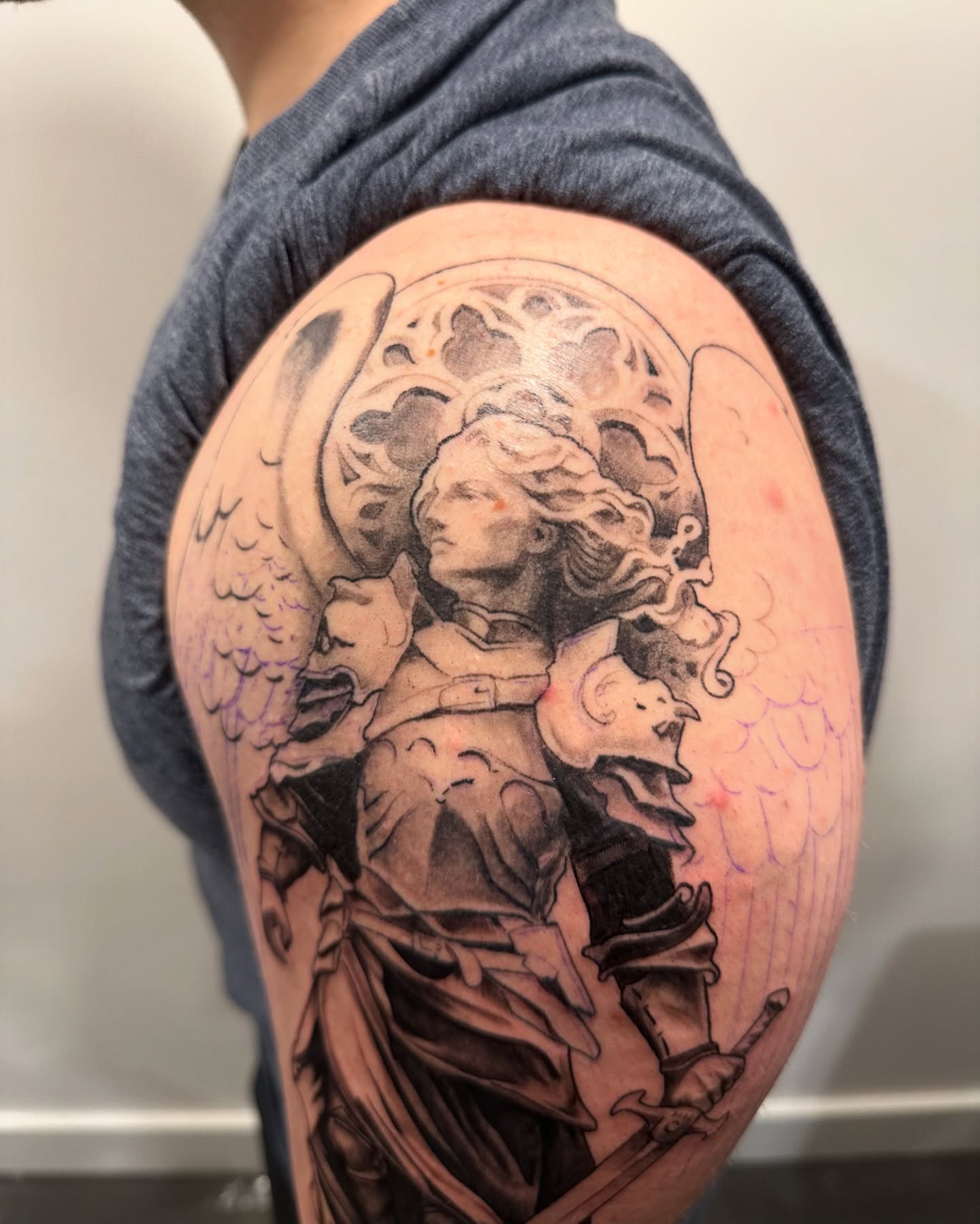 Angel with sword black and grey tattoo on the shoulder by Ben Cisek