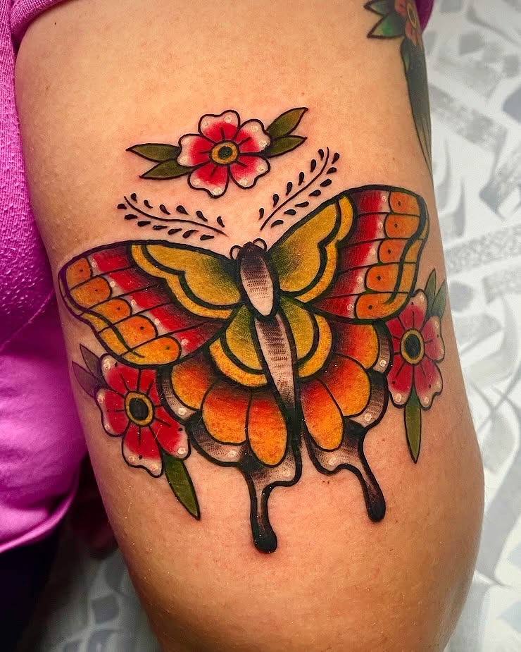 Butterfly and flowers American traditional tattoo on the thigh by ✶ 𝑺𝑰𝑳𝑽𝑨𝑵𝑨