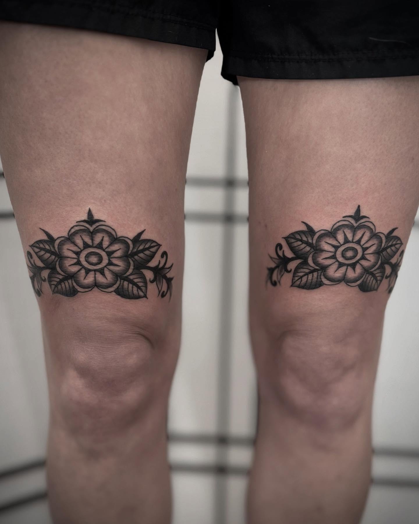 Floral design black and grey tattoo on the thigh by Micah Norman, San Francisco, California