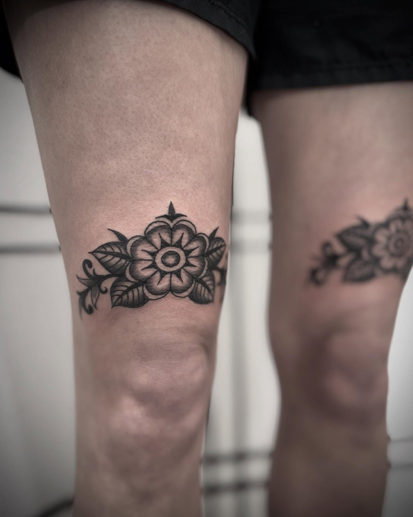 Floral design black and grey tattoo on the leg by Micah Norman, San Francisco, California