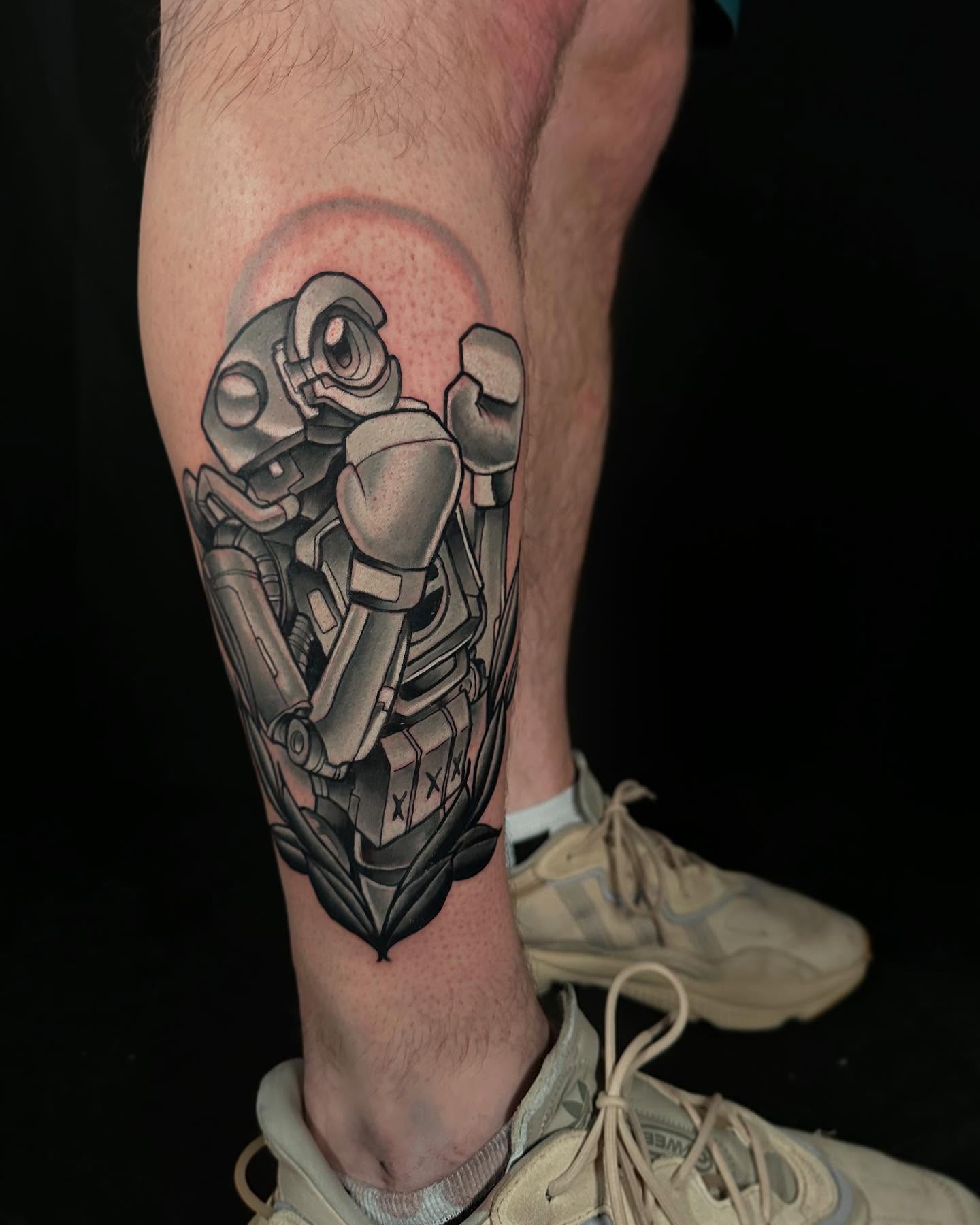 Mecha robot black and grey tattoo on the calf by John Milosh Chamberlin