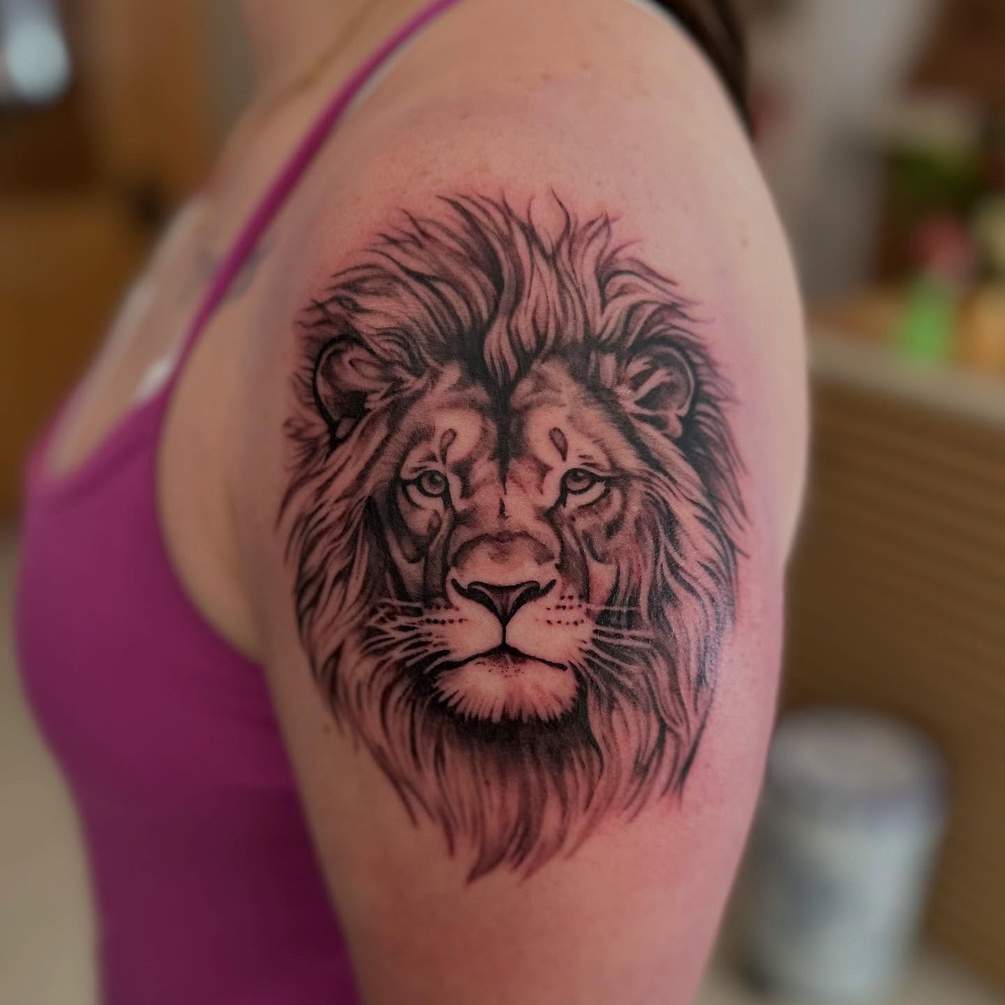 Lion realism tattoo on the shoulder by Abigail Townsend