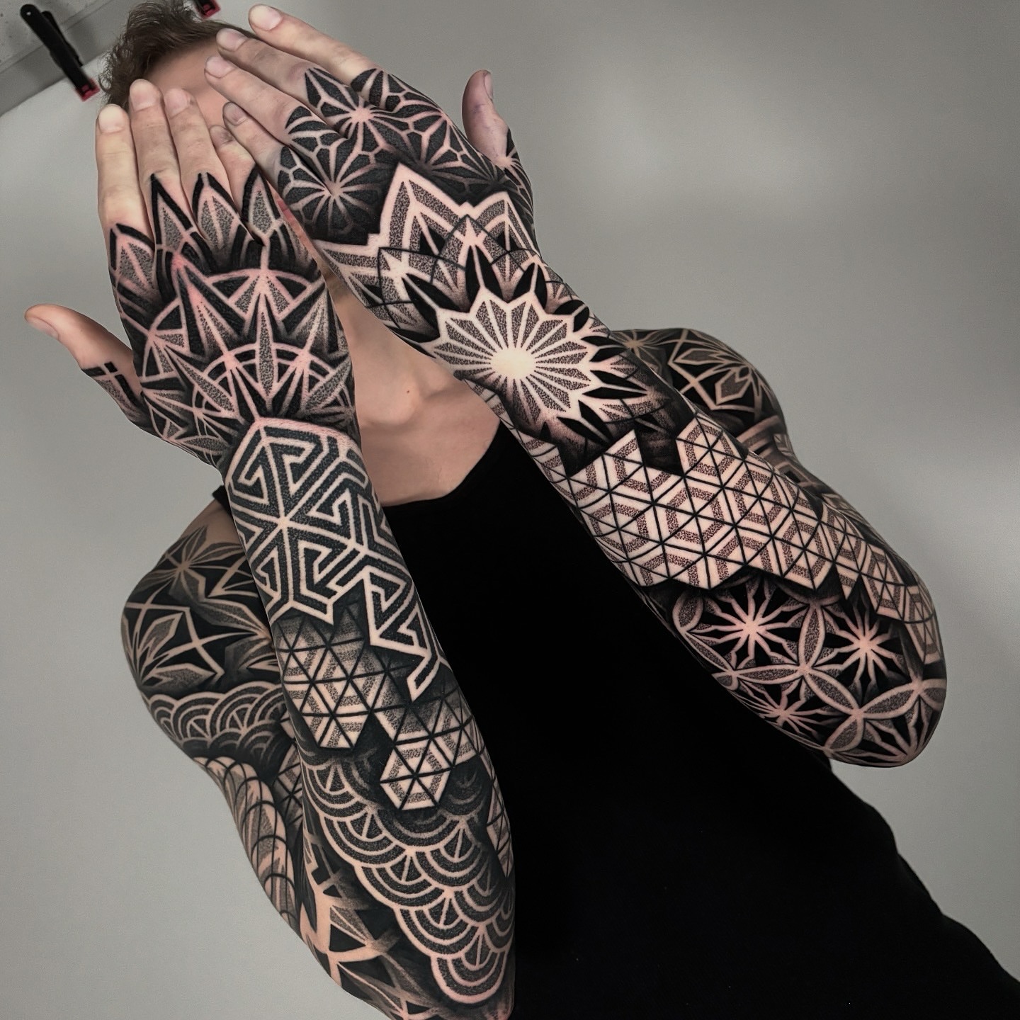 Geometric patterns geometric tattoo on the upper arm by Mitch Koch