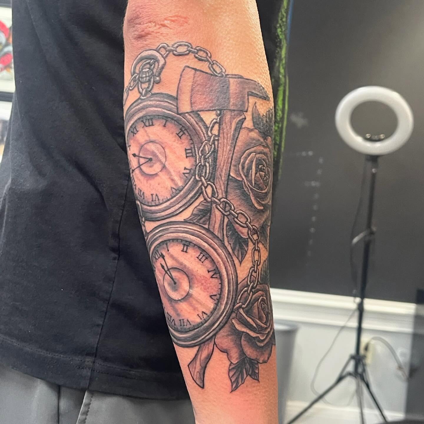 Clocks and roses realism tattoo on the forearm by Missy (Miz)
