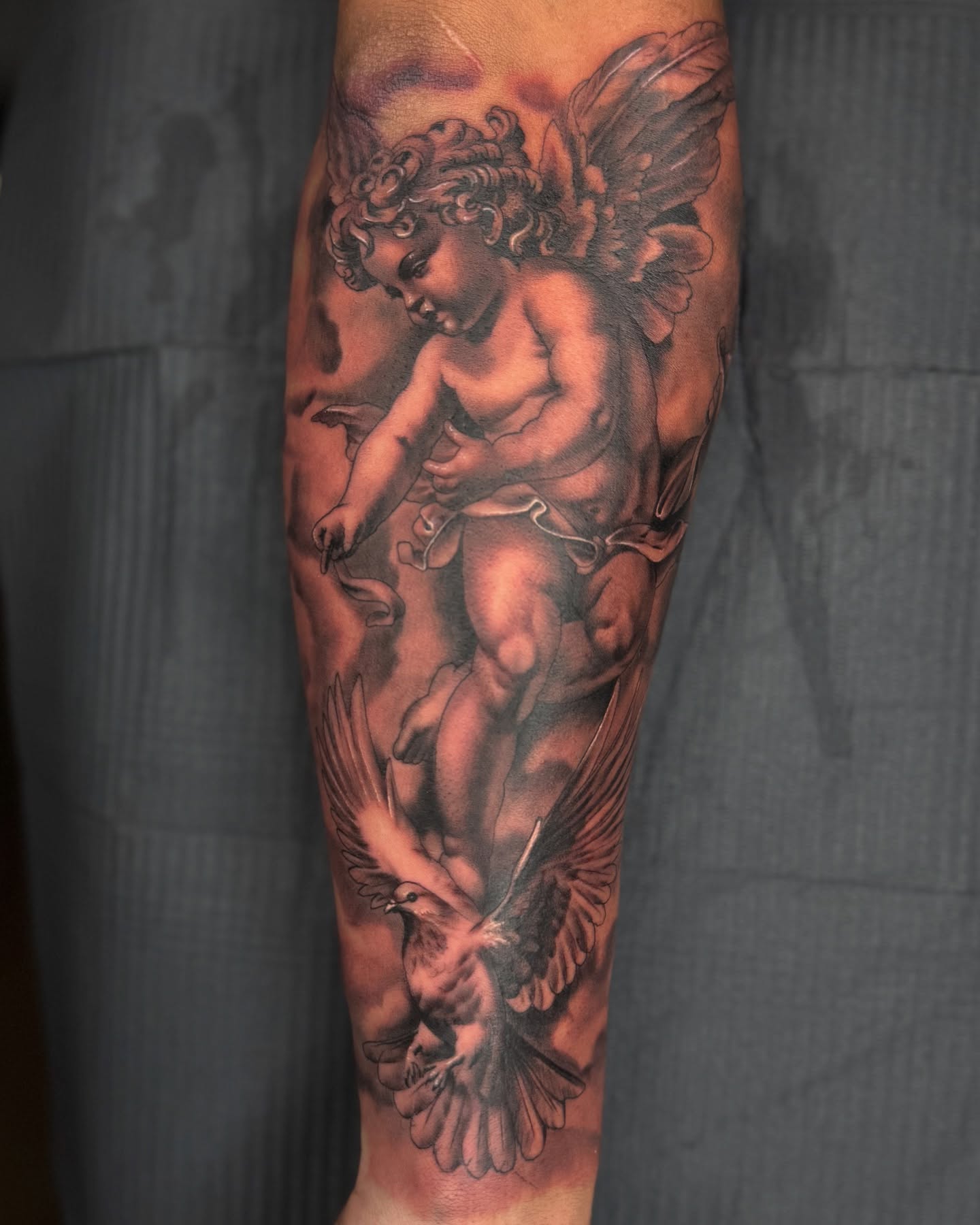 Tattoo by @suave.serg714 β realism, black_and_grey