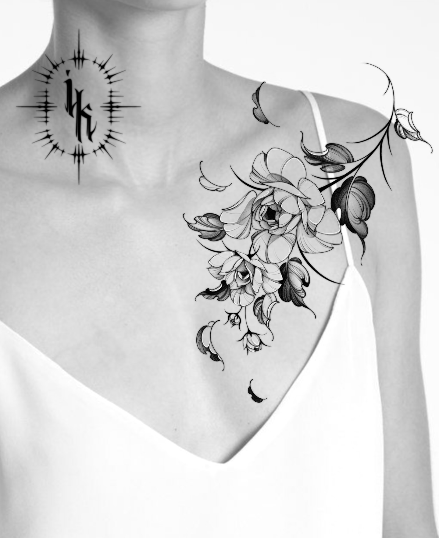 Floral arrangement black and grey tattoo on the chest by IVY