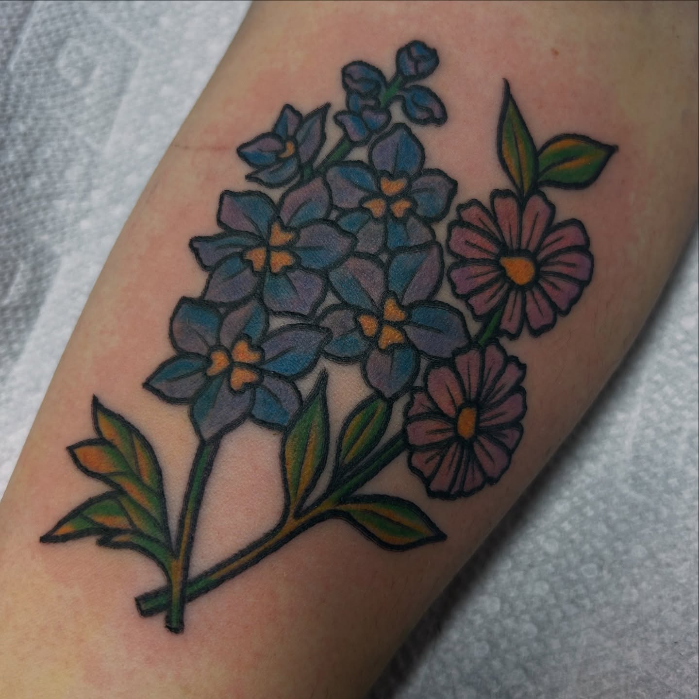 Flower bouquet American traditional tattoo on the forearm by Lauren Caldwell 🔮🌙