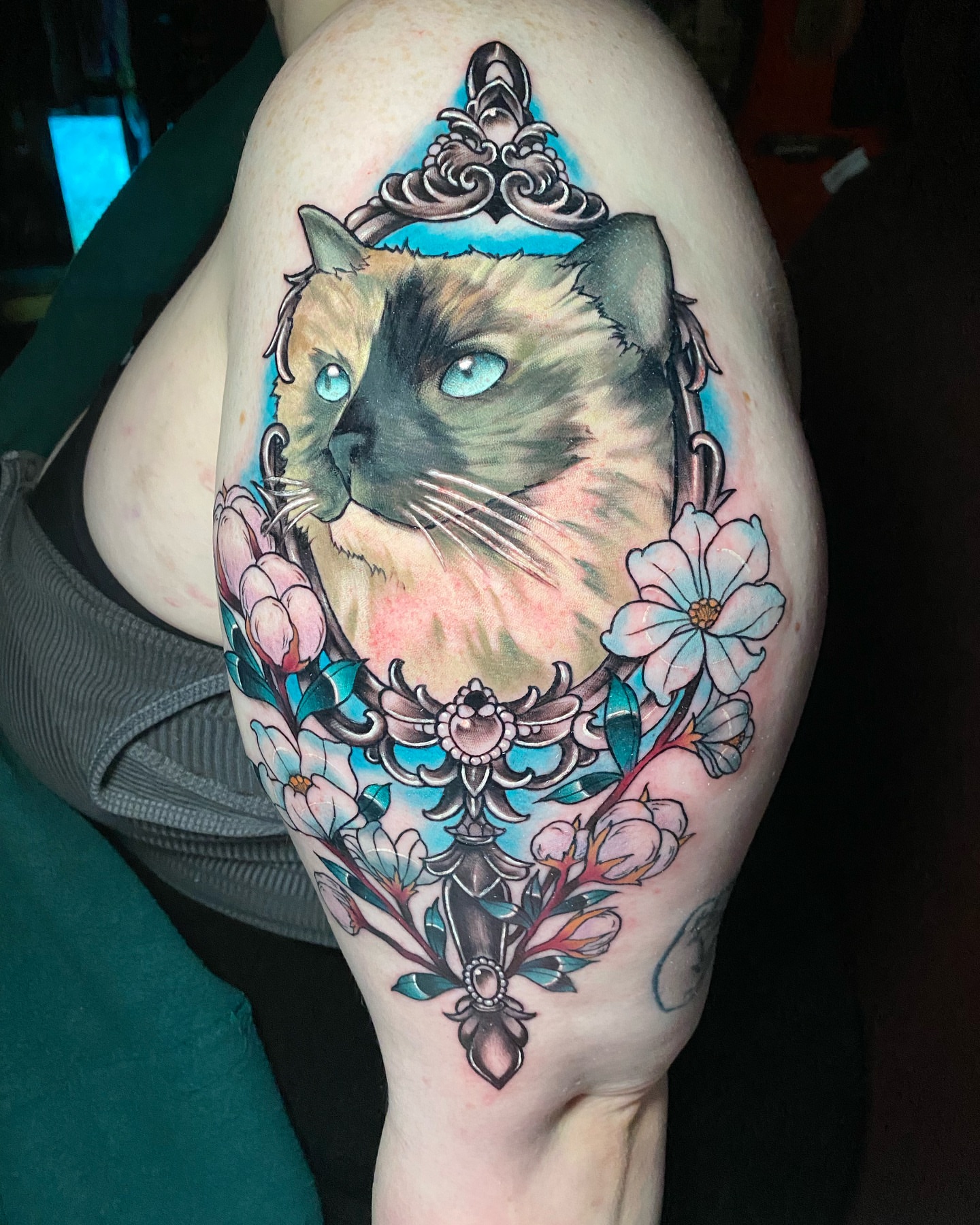 Cat with floral crown realism tattoo on the thigh by Tattertot