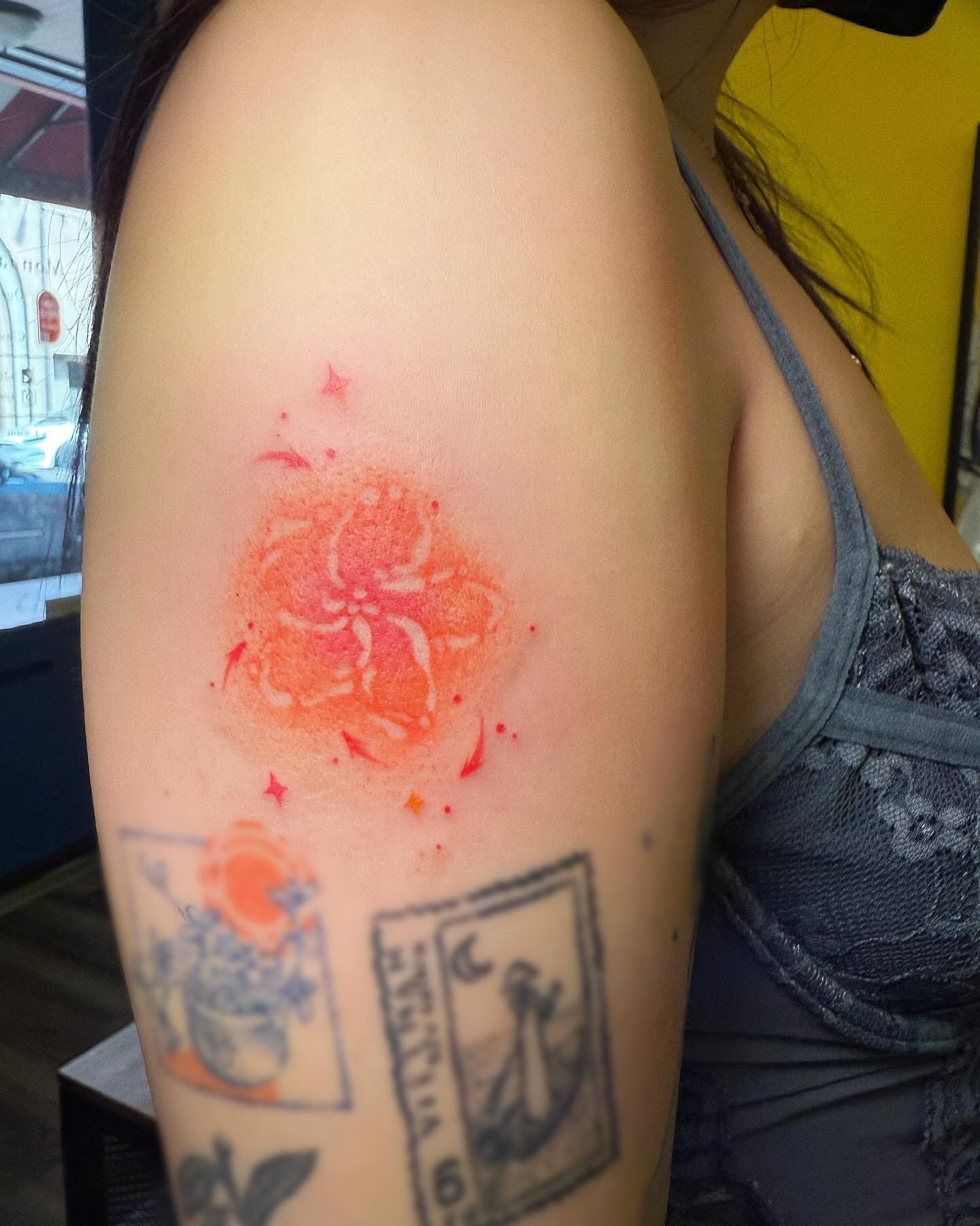 Watercolor flower watercolor tattoo on the shoulder by Echo