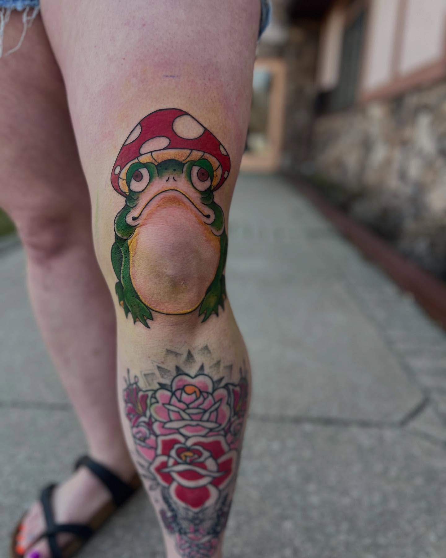 Frog with mushroom hat American traditional tattoo on the thigh by Katie Sayre