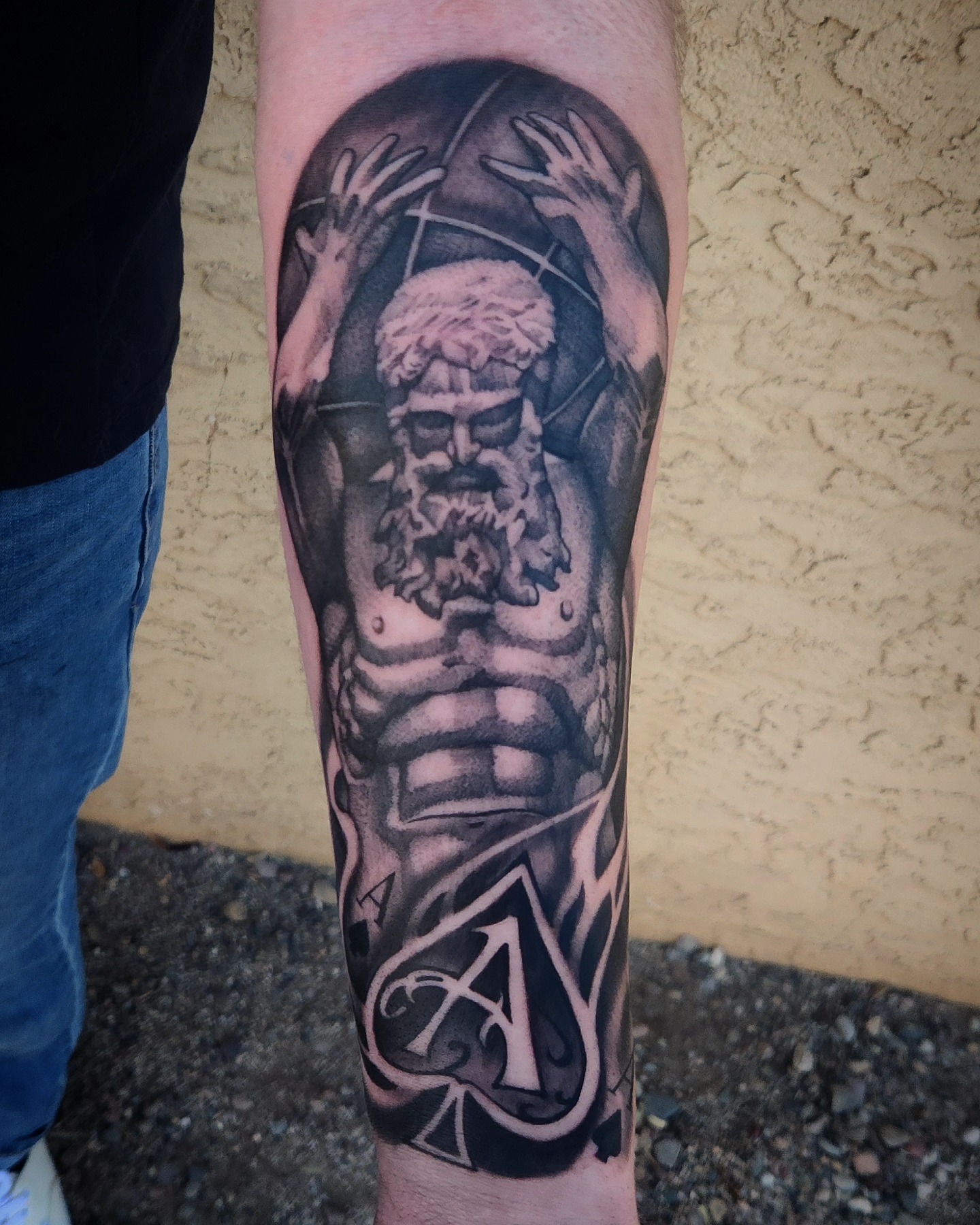 God-like figure realism tattoo on the forearm by Jack Jr Mora