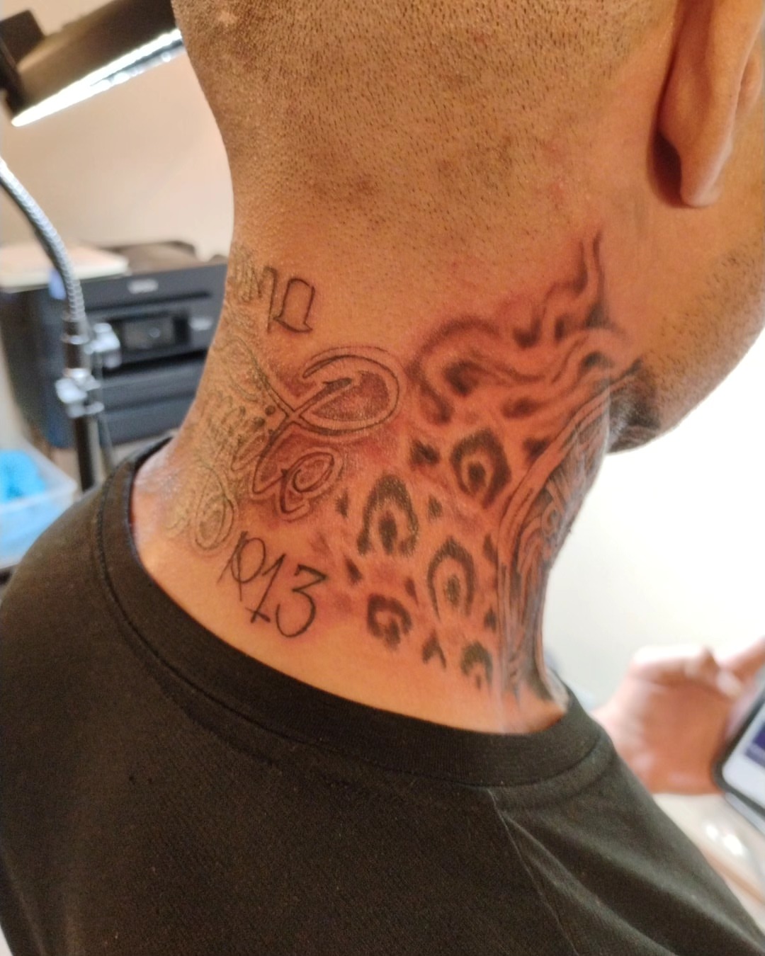 Leopard print black and grey tattoo on the neck by Alfredo Sosa