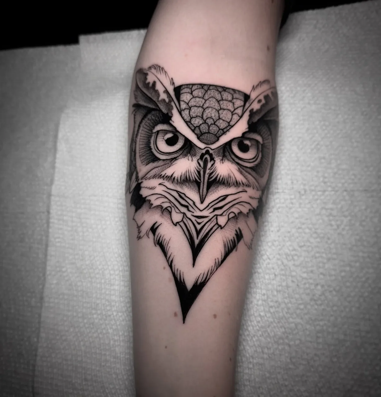 Owl geometric tattoo on the forearm by David Mushaney