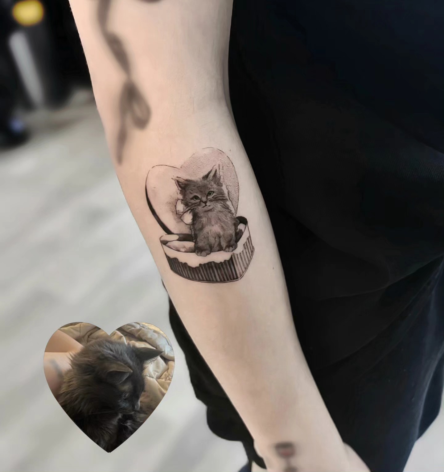 Cat in heart realism tattoo on the forearm by Vintage tattoo