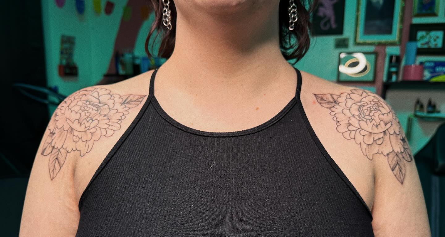 Peony flowers black and grey tattoo on the shoulder by Paulina Vazquez