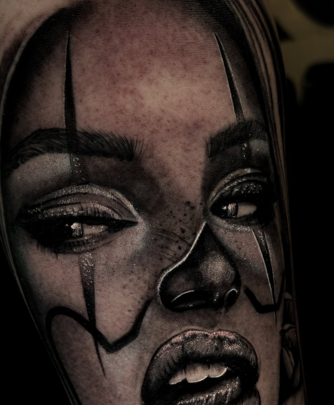 Clown face portrait Chicano tattoo on the forearm by Alejo Ibanez Tattoo