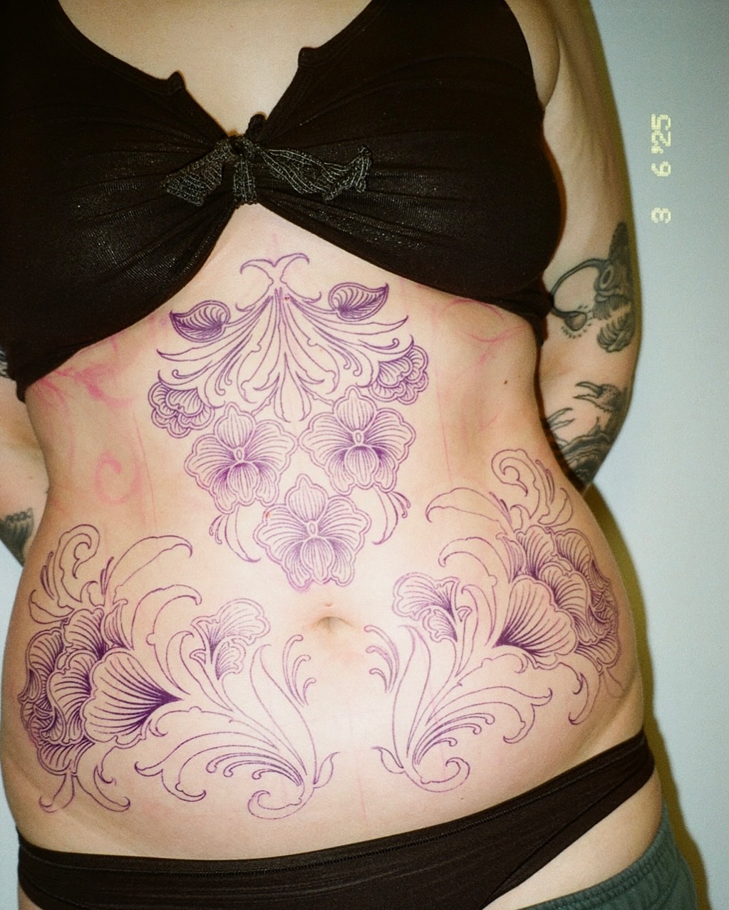 Floral design ornamental tattoo on the torso by abigail 🌸