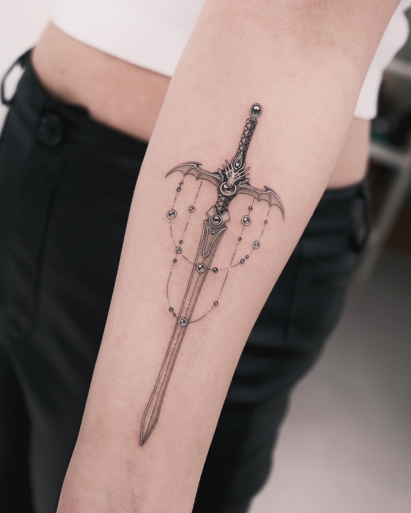 Sword geometric tattoo on the forearm by p o b i