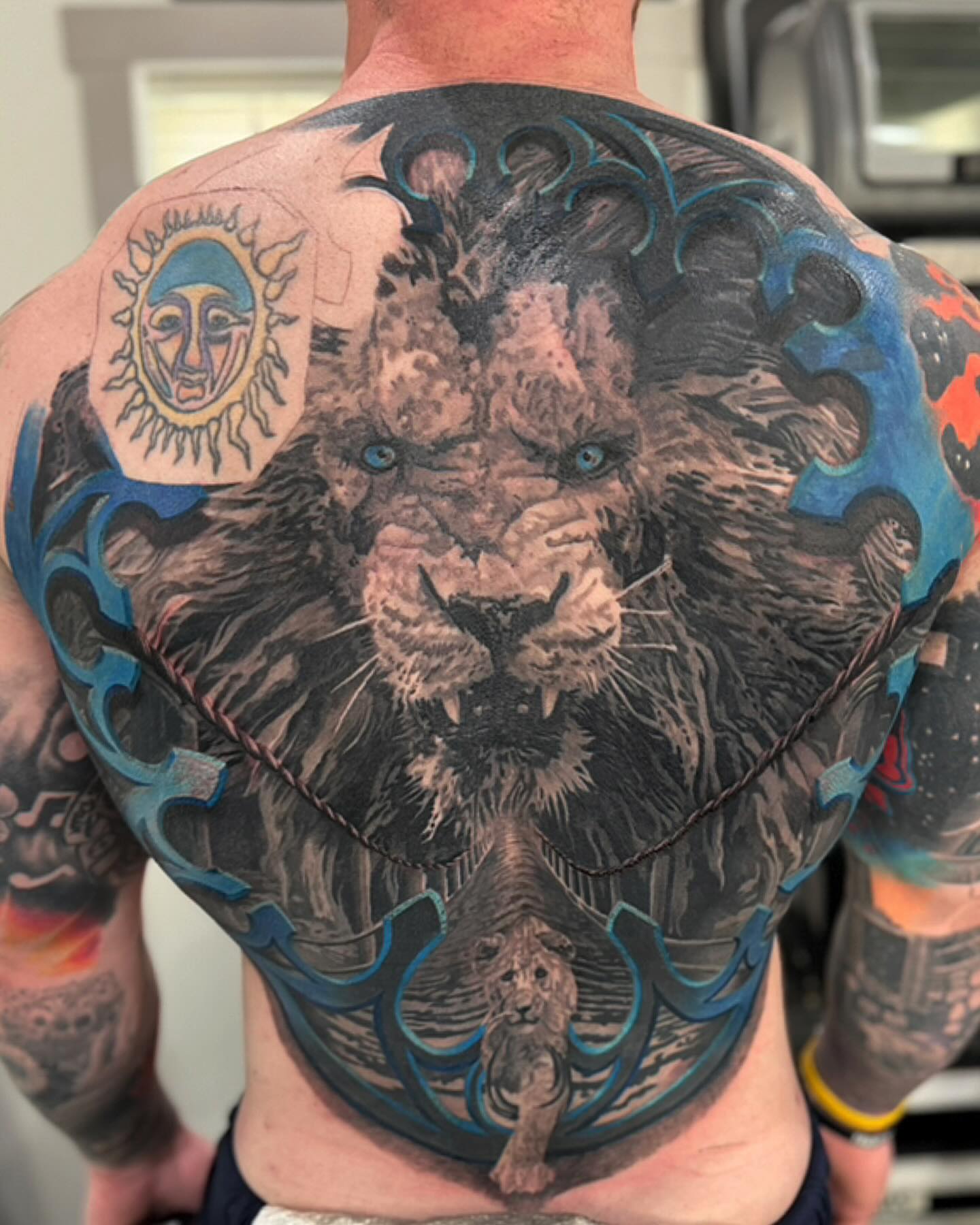 Lion realism tattoo on the back by marcus labonne