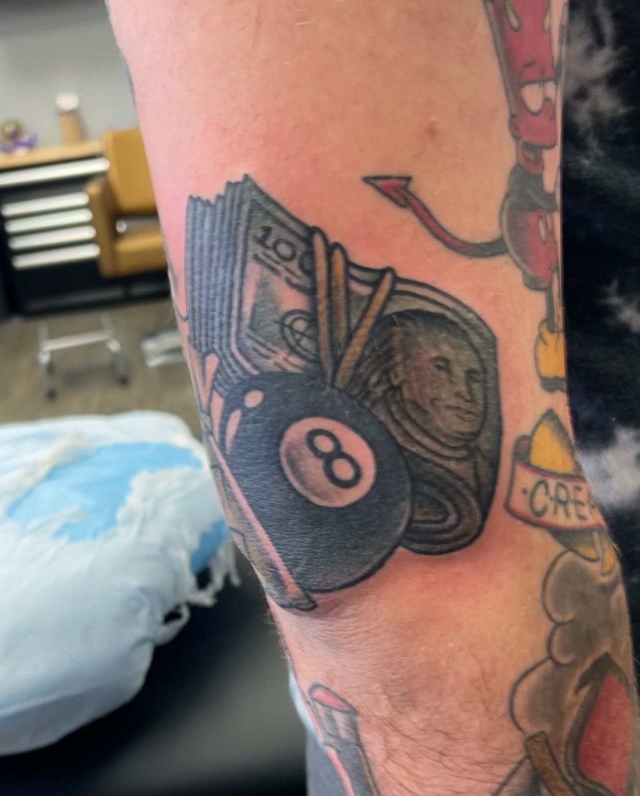 8-ball astronaut American traditional tattoo on the forearm by Jaxson Eugene Brady-Hobart