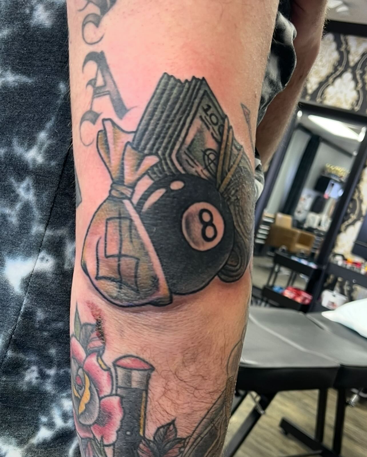 Billiards and money American traditional tattoo on the forearm by Jaxson Eugene Brady-Hobart