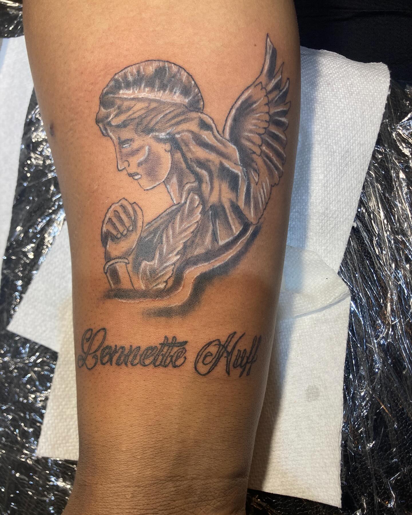 Angel black and grey tattoo on the forearm by Illuminink.gallery