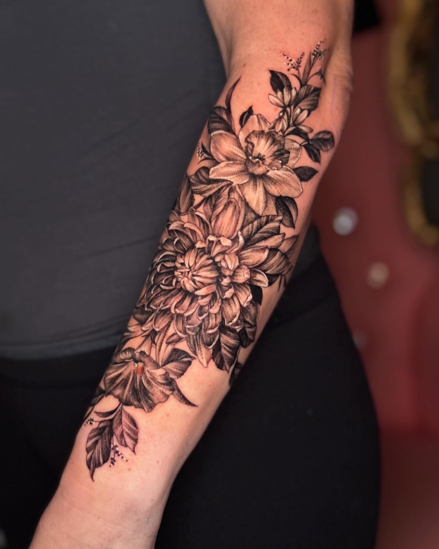 Floral bouquet black and grey tattoo on the forearm by Martina Zago