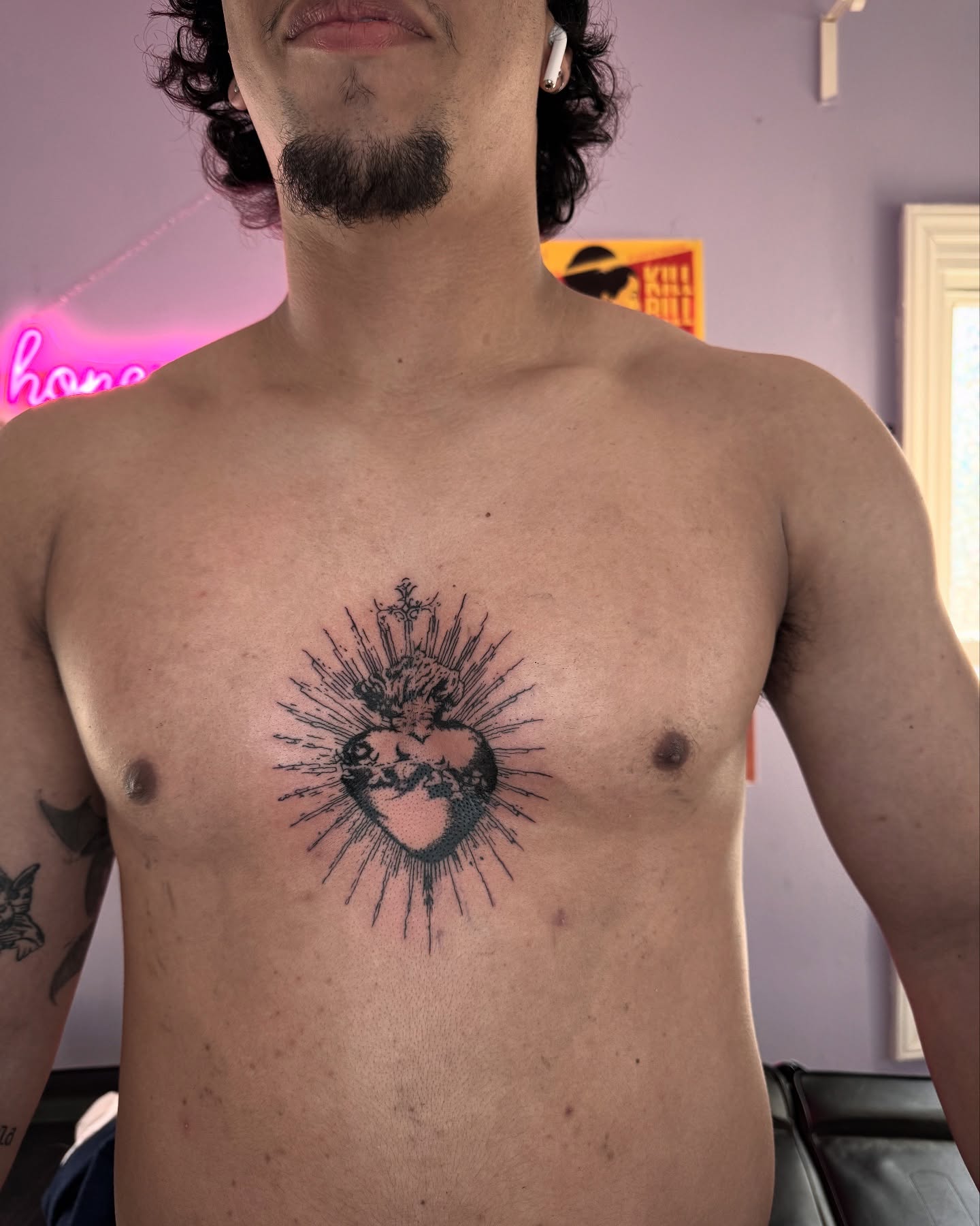 Sacred heart dotwork tattoo on the chest by Honey