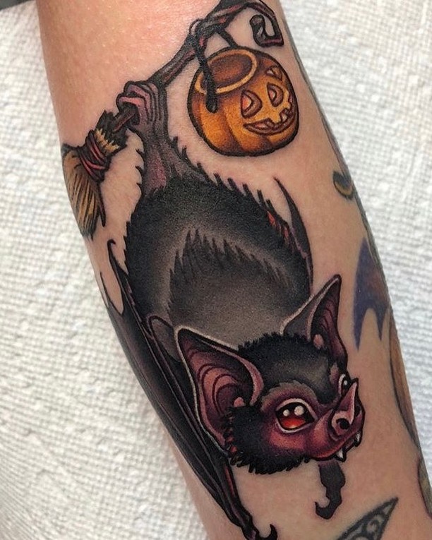 Bat with pumpkin American traditional tattoo on the forearm by Alexandra Fische