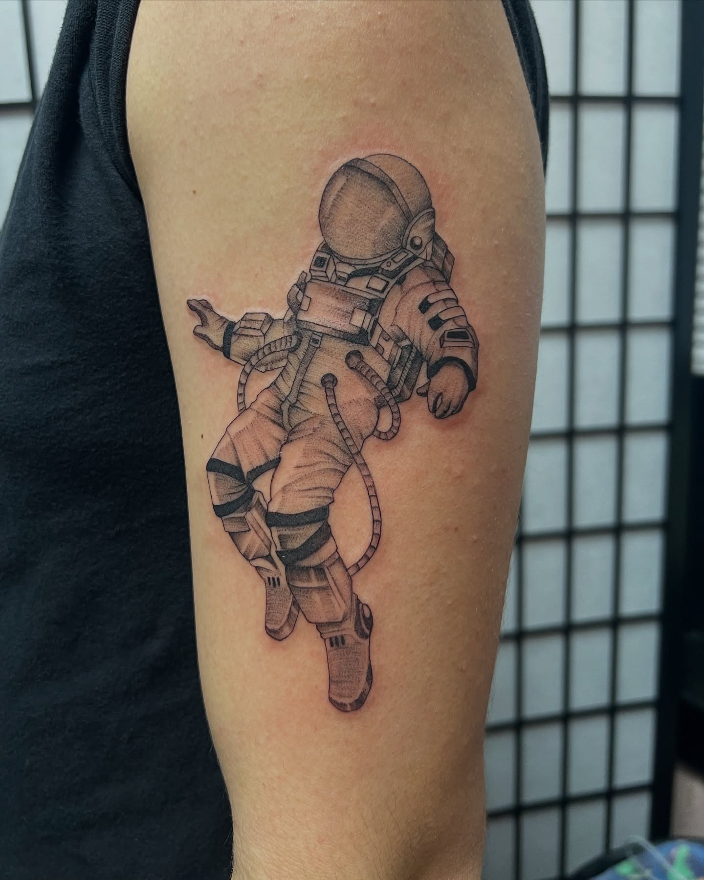 Astronaut realism tattoo on the forearm by Baung Ben
