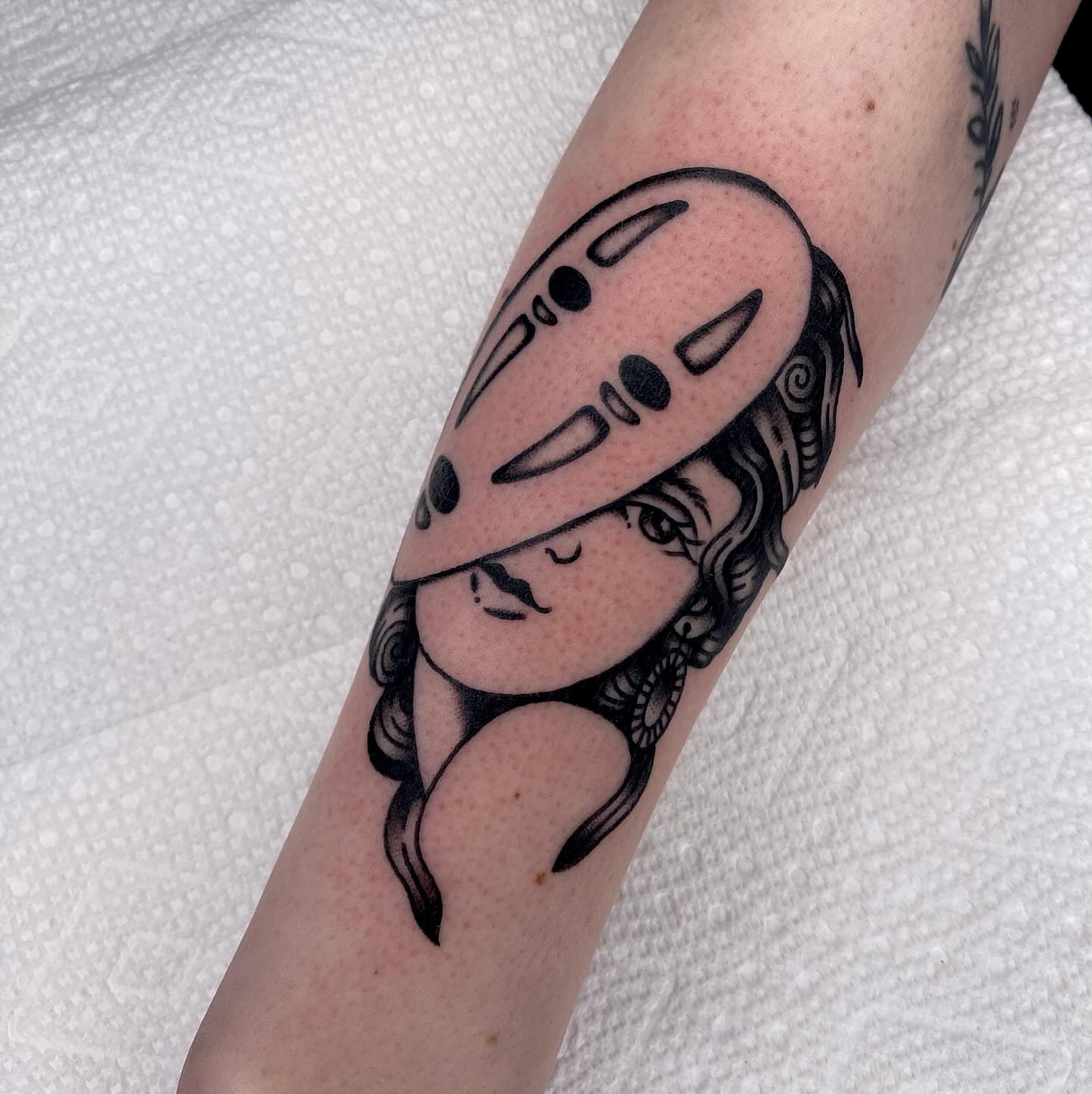 Mask and woman dotwork tattoo on the forearm by Justin R. Mitchell, Fort Worth, Texas