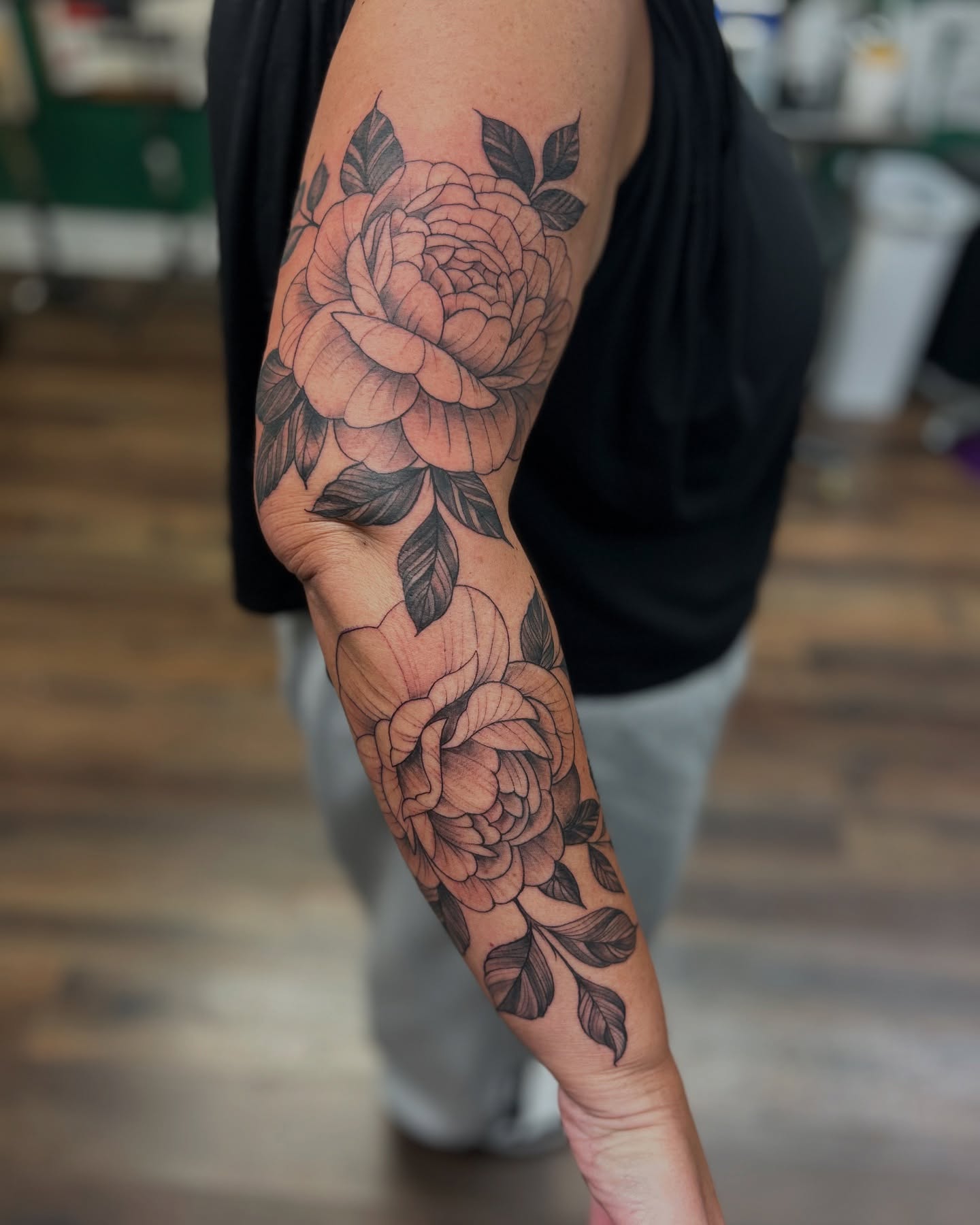 Roses black and grey tattoo on the forearm by Patricia Cunningham