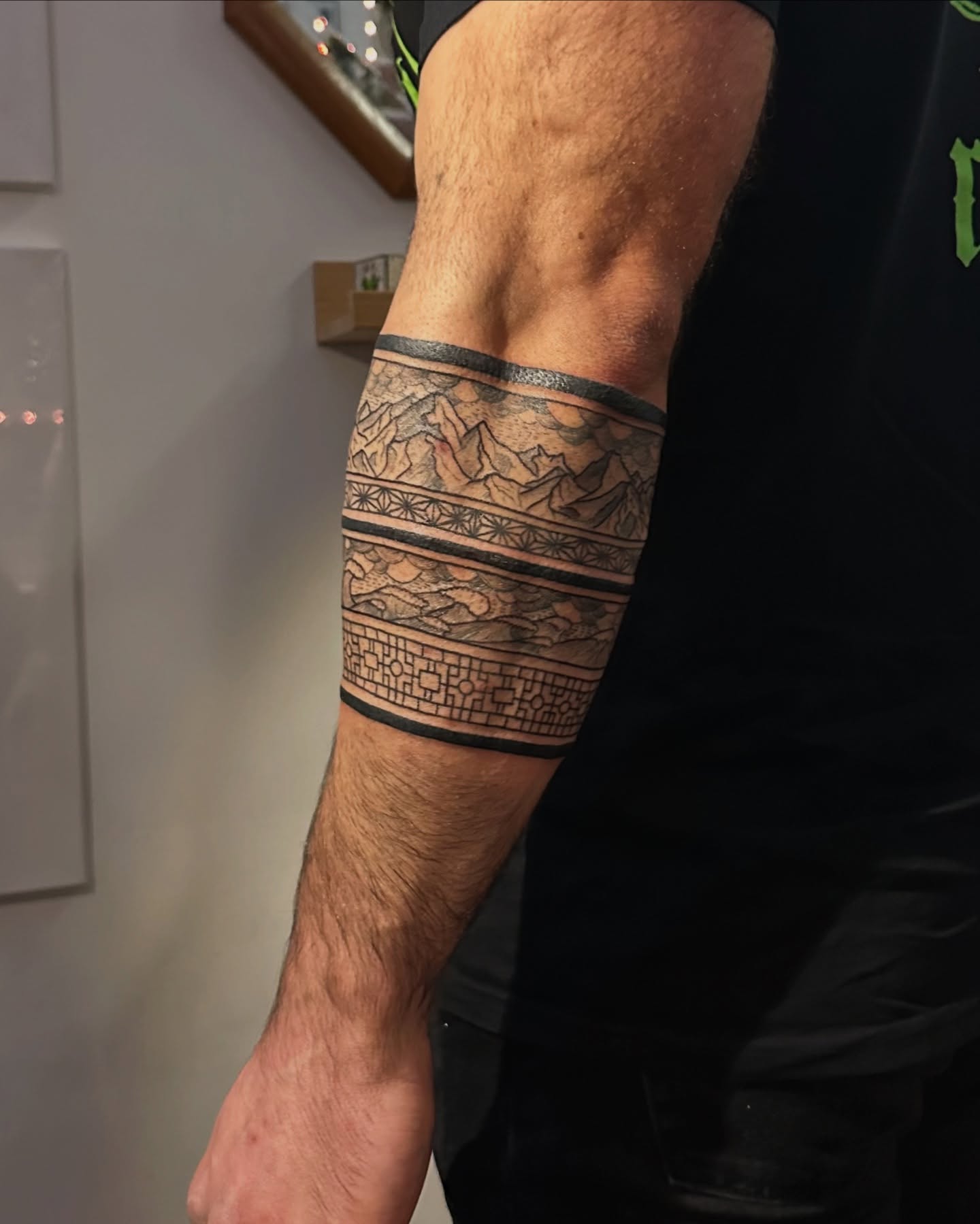 Mountain range tribal tattoo on the forearm by Piccolino, Cambridge, Massachusetts