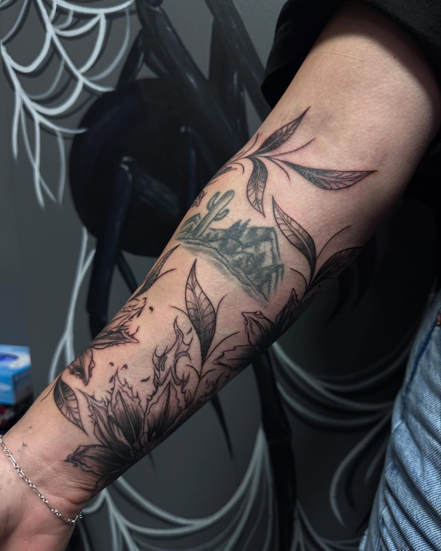 Desert flora geometric tattoo on the forearm by Jianna