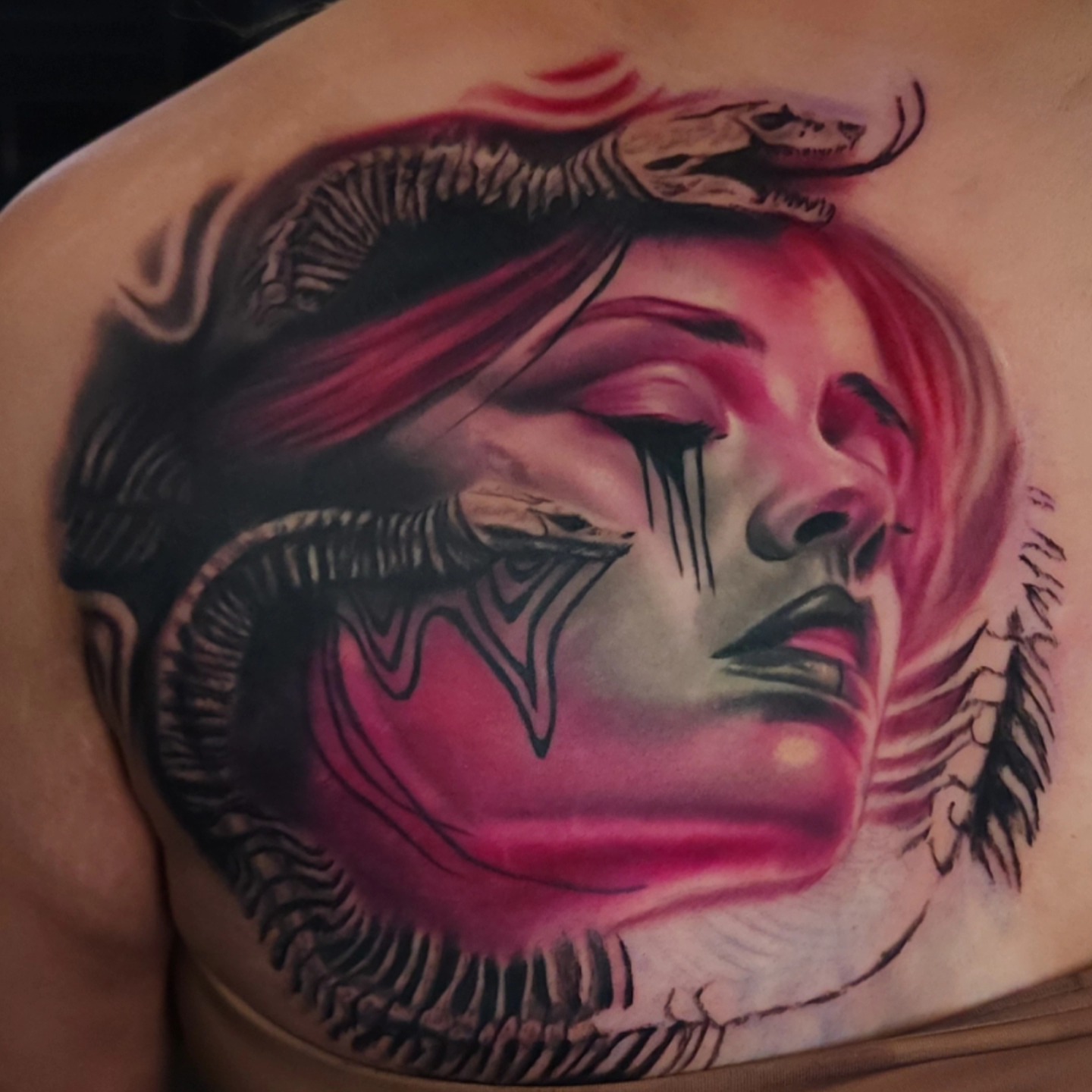 Woman with snake realism tattoo on the chest by Color Realism Tattoos - Metro Detroit