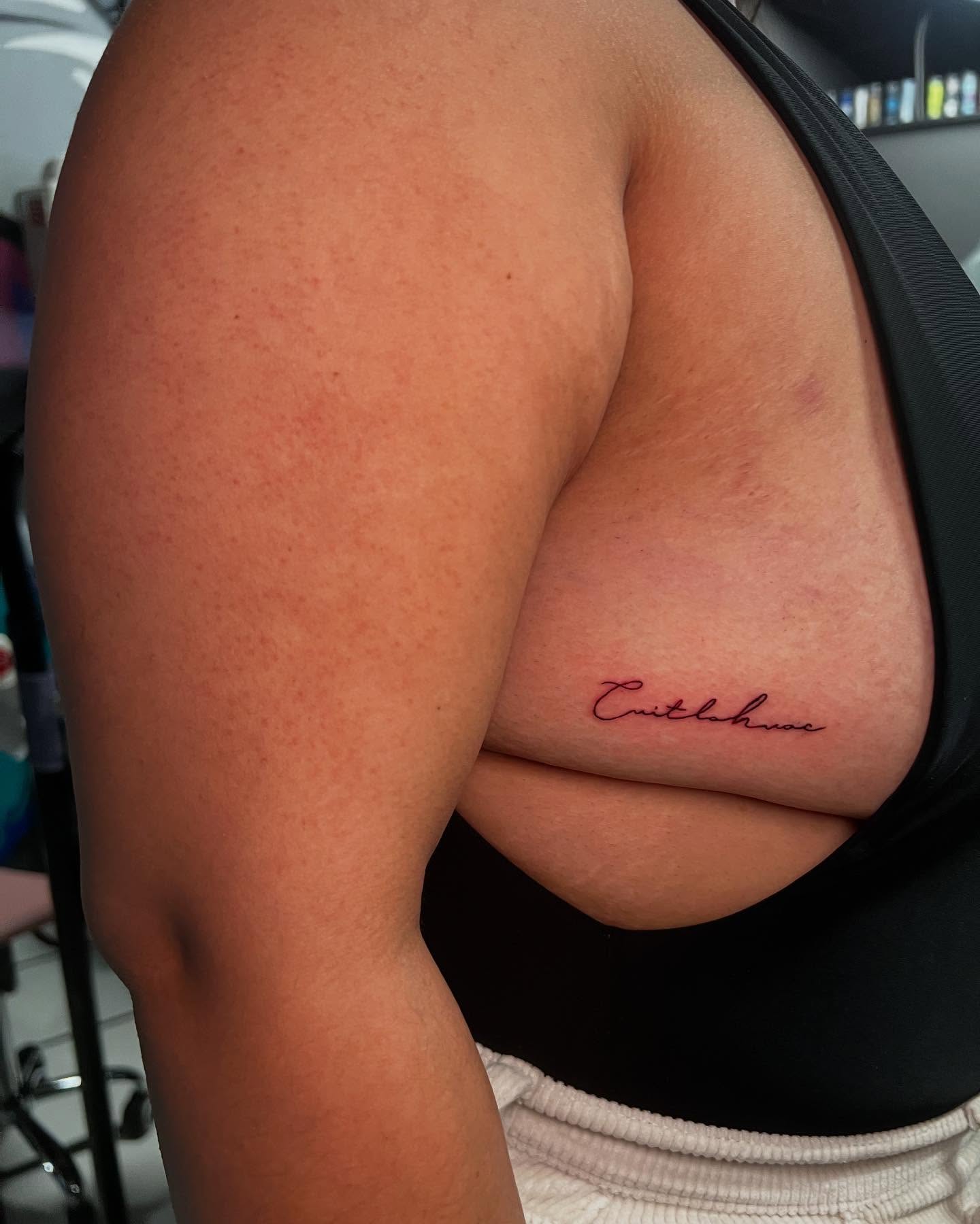 Script lettering lettering script tattoo on the chest by Jasmin Lozano