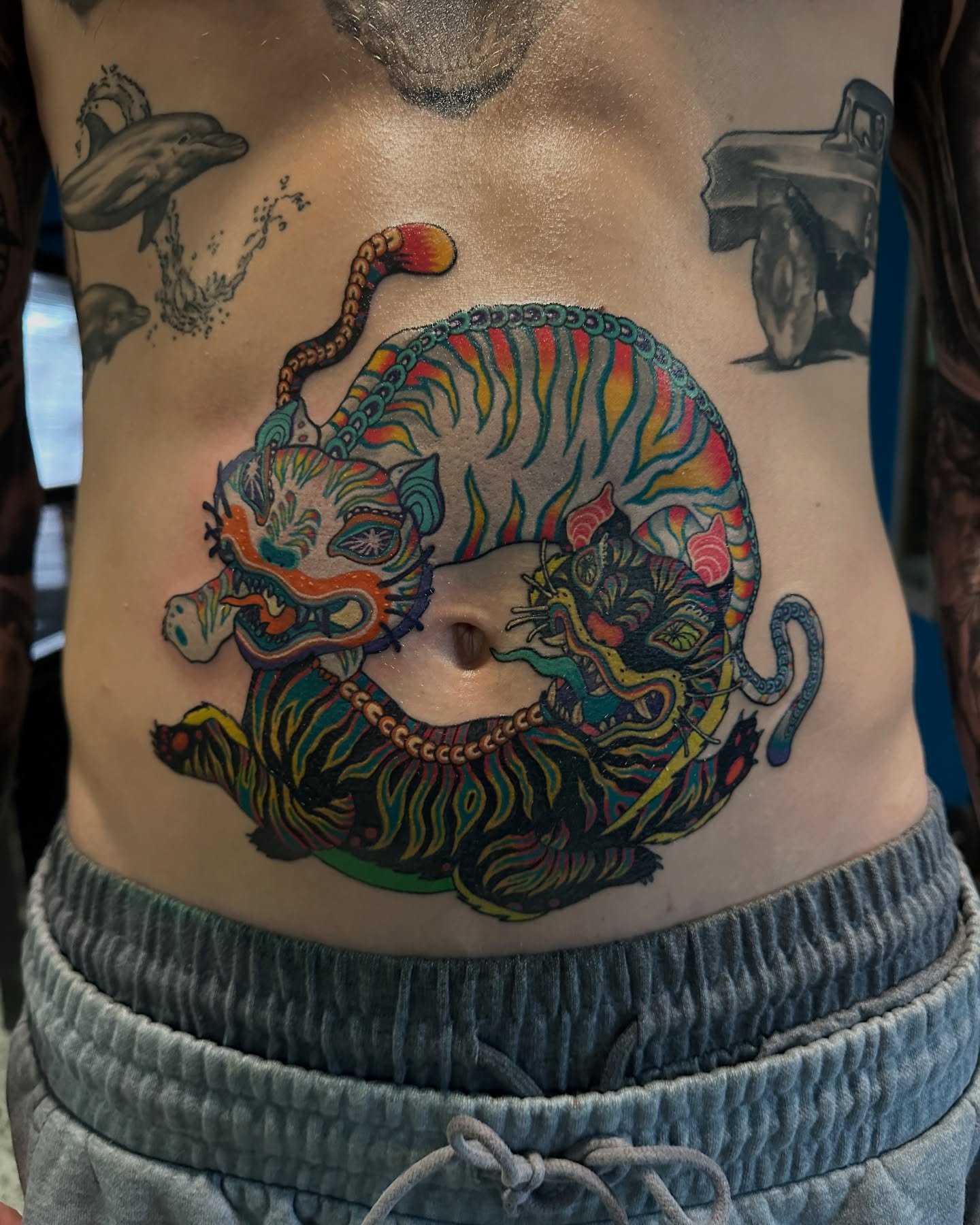 Tiger new school tattoo on the torso by (Joshua) Van Cummings