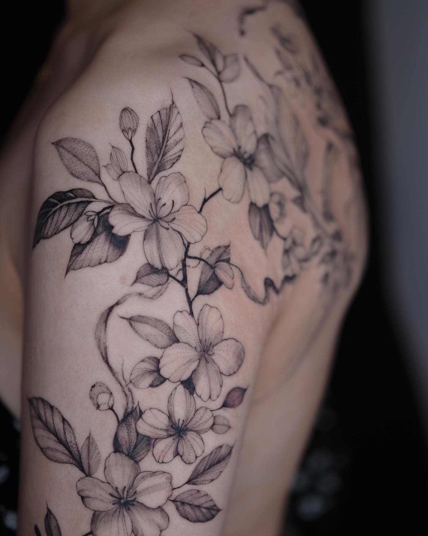 Flower bouquet black and grey tattoo on the shoulder by Tattoo artist in Boston