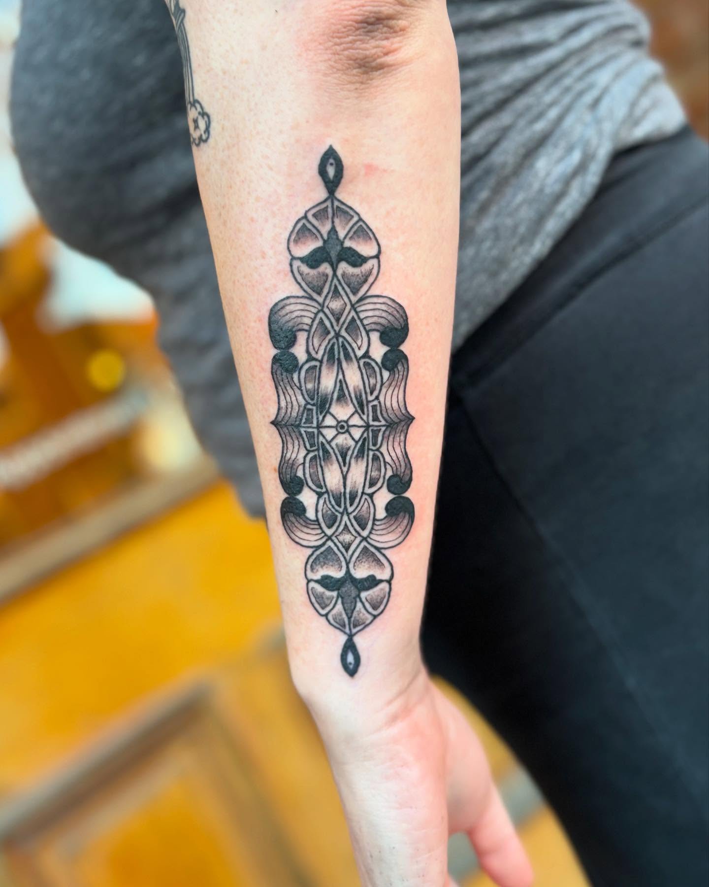 Geometric pattern geometric tattoo on the forearm by kris noble floyd