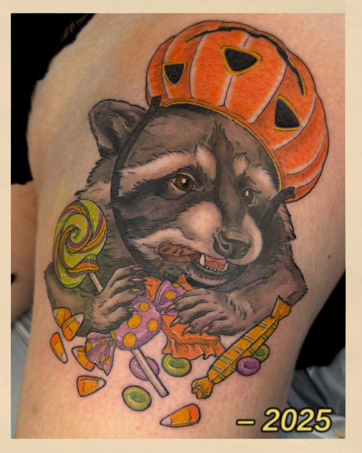 Raccoon with pumpkin hat realism tattoo on the upper arm by ..✨ K I R S T y y O R K ✨..