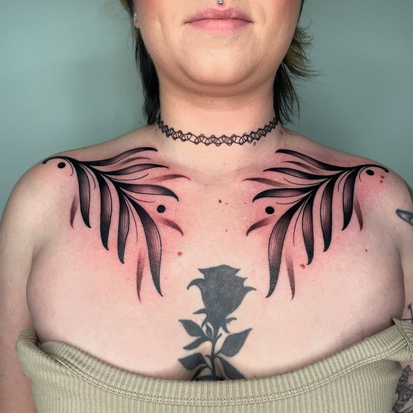 Wings and rose black and grey tattoo on the chest by Angel, Salt Lake City, Utah